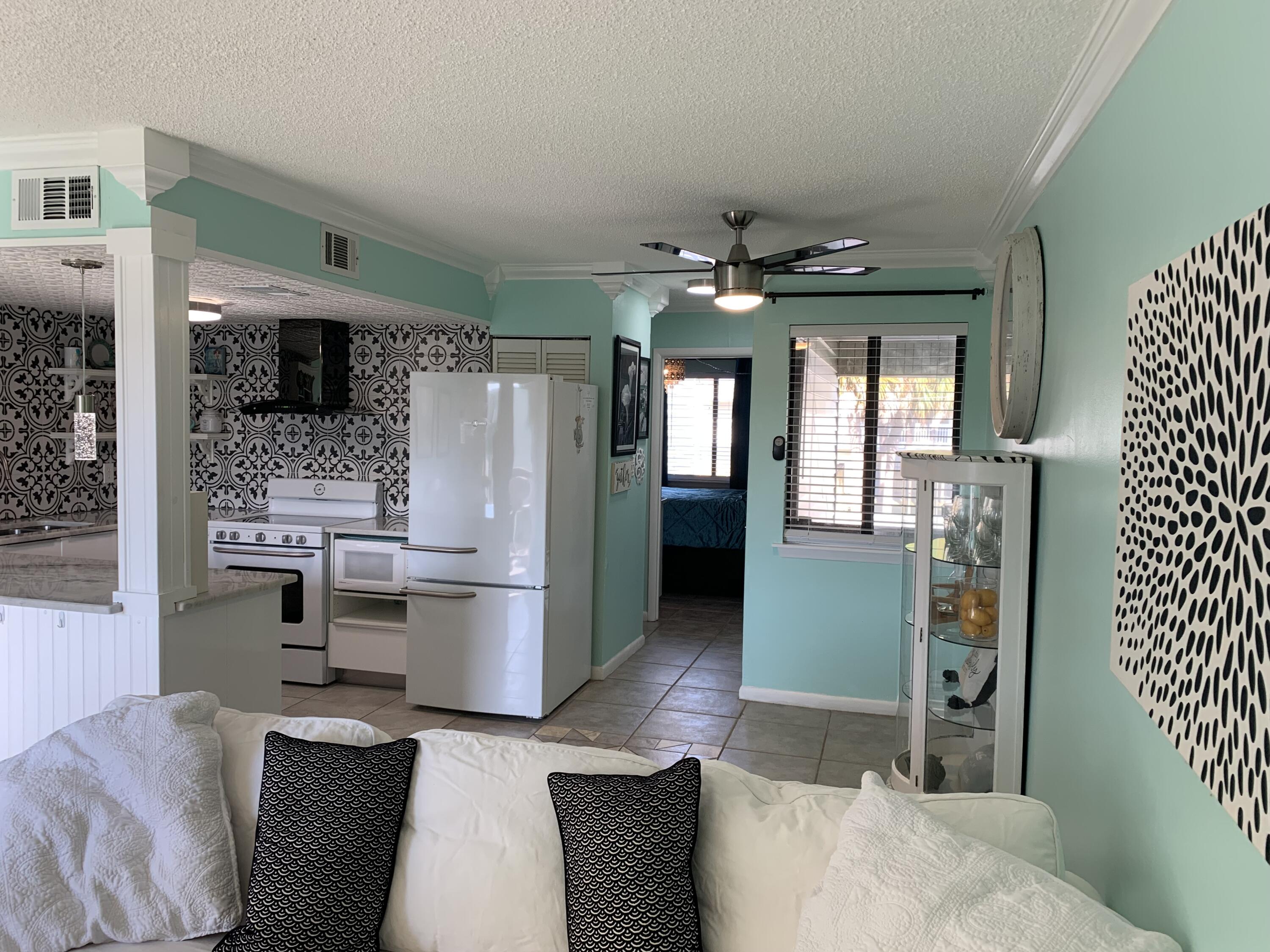 SWEET FURNISHED CONDO includes sleep number bed, remodeled open floor plan, sweet balcony with a little view of the intercoastal waterway.  WASHER & DRYER in unit. FOUNTAINHEAD has many great amenities including a club house with pool table, ping pong & kitchen. Fish off the docks, paddleboard and swim in a sparkling pool. The sunsets are gorgeous !!!