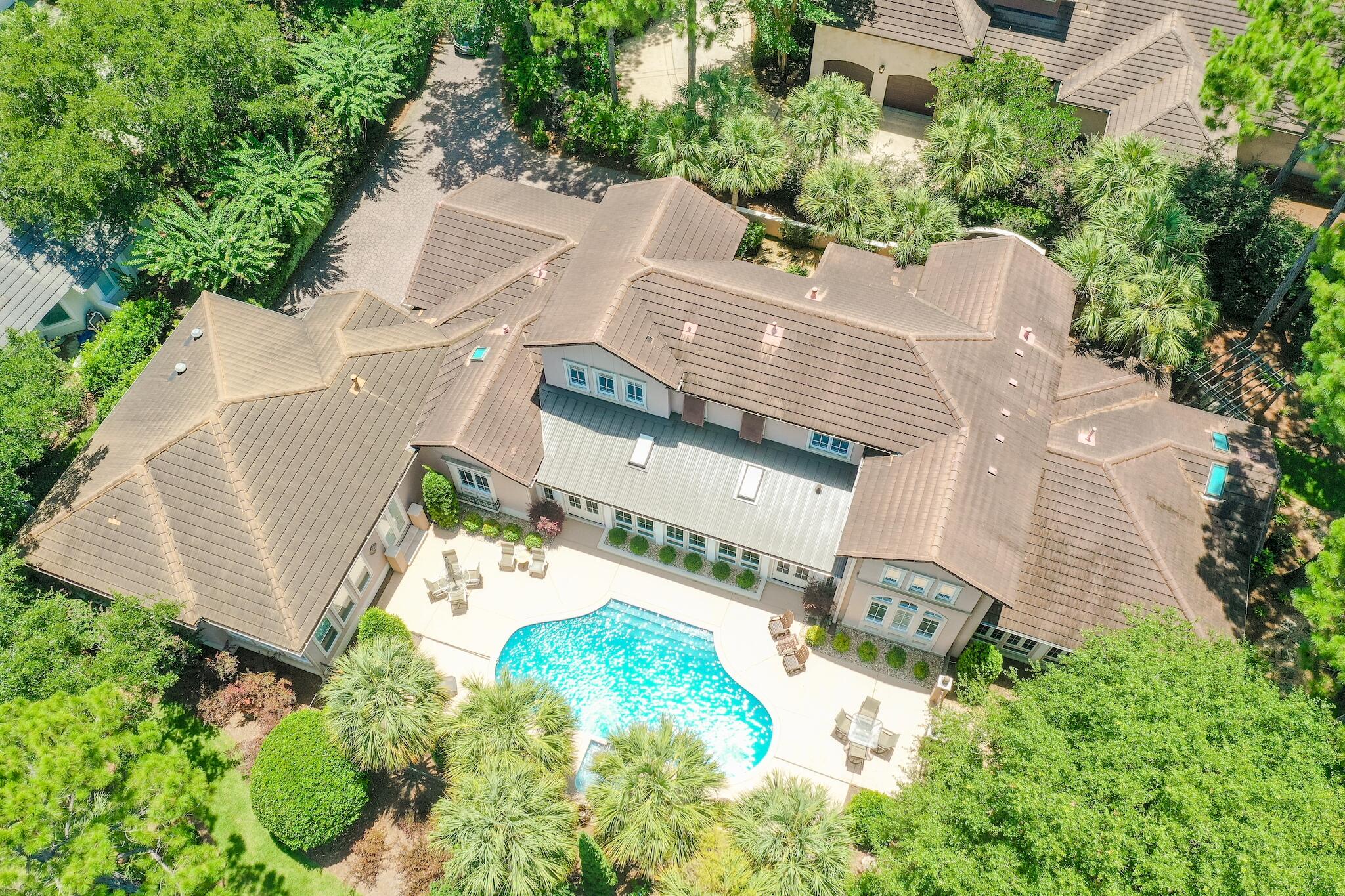 Located on one of the most desirable lots in all of Sandestin, this beautiful legacy home is a rare, one-of-a-kind opportunity to own the flagship property in Island Green. Designed by renowned architect, Tom Christ, this stunning home of over 6,800 sq.ft. capitalizes on 295ft. of lake frontage to create maximum privacy while combining abundant natural light with interior openness. Spectacular views of The Raven Golf Course, including the signature #6 hole, can be seen from almost any room along the north facing side of the home. In 2012 an expansion by Boswell Builders added over 1500 sq. ft., resulting in a magnificent master bedroom/bath suite at the East end of the home. The first floor of this home features oak & mahogany hardwood floors, 10' ceilings, 10'' crown molding, two large master bedroom suites, a 40' enclosed sunroom with skylights & Travertine tile floor, a living room with vaulted 24' ceiling, dining room, open kitchen/family room & office.  The lavish, east wing master bedroom suite has a separate sitting area, mahogany hardwood floors, trey ceilings, & abundant lake views, while the luxurious master bath features Carrara Marble floors & countertops, his/her tiled showers (steam), his/her water closets (bidet), & his/her walk-in closets.  The spacious, west wing master bedroom suite features oak hardwood floors, separate sitting and dining areas, walk-in closet, master bath with cultured marble countertops, jacuzzi tub, & floor to ceiling windows facing west & north for magnificent views of the lake & golf course.  Two 2nd floor guest bedrooms with en-suite bath rooms, along with laundry facilities on both floors complete the home interior.  A beautiful in-ground pool & fountain, replastered in 2015, form the centerpiece for a spacious outdoor patio/entertaining area surrounded by never-ending lake views.  The property is situated at the end of a private cul-de-sac & has a two-car paver garage & a separate golf cart garage.
Sandestin Golf & Beach Resort is one of the South's premier resorts.  Sandestin has over seven miles of beaches, gulf & bay frontage.  Sandestin's four golf courses were designed by iconic course designers Robert Trent Jones Jr., Rees Jones and Tom Jackson.  The championship golf courses are Raven Golf Club, Baytowne Golf Club, The Links Golf Club & the exclusive Burnt Pine Golf Club.  For the tennis player, Sandestin offers 15 tennis courts (hard & clay).  Sandestin has 19 swimming pools, a 113-slip marina, a fitness center & spa.  Baytowne Wharf offers great boutique shopping, restaurants & night life.  Sandestin marina offers jet skis, canoes, boogie boards, kayaks, pontoon boats, sailing, snorkeling & scuba diving.  The Baytowne marina also offers evening cruises, bay fishing & deep sea fishing.  For sophisticated dining & upscale shopping, visit Grand Boulevard where you will find Emeril's Coastal, Flemings Steak House, Cantina Laredo, The Wine Bar, Tommy Bahamas, The Pottery Barn, Williams Sonoma, Anthropologie, Peter Millar, lululemon, and many more.