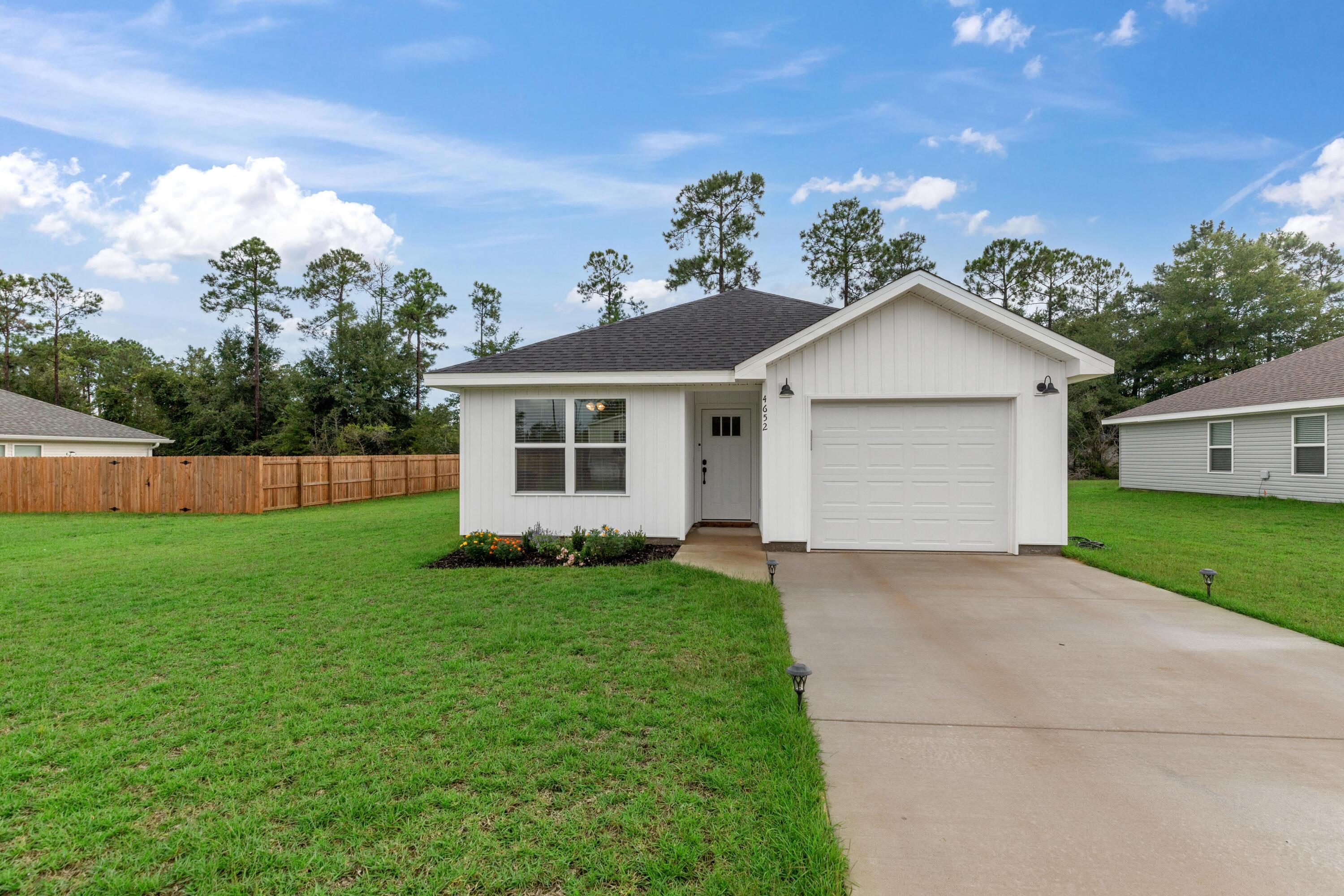 Built in 2023 this home has hardly been lived in, and it shows. This home is like new and ready for occupancy. Located off Highway 90 this home offers a quick commute to Hwy 10 or Hwy 285. Featuring a split floor plan, the 1st bedroom and guest bathroom are located close to the entry way. Kitchen offers granite surfaces, stainless steel appliances, island with overhang for bar seating and is open to the living room. Attached is a 1 car garage. Outside you have a nice, lush yard that's easy to maintain but not fenced.