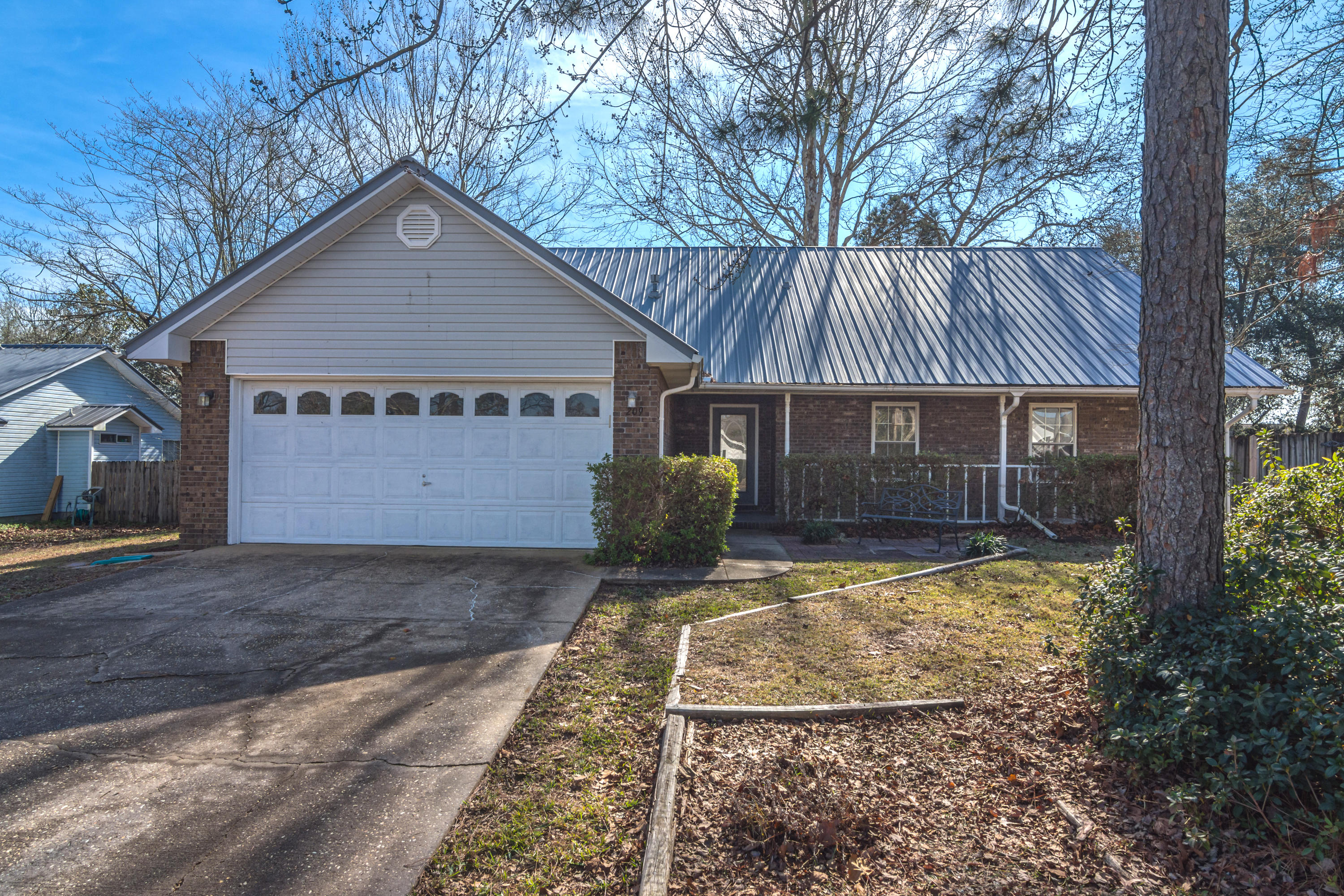 This south Crestview home is ready to move in now! All brick and situated with easy access to Hwy 85 or I-10 travel. This all brick home is located on a level lot with a fenced backyard and storage shed for additional outside room.  Large front porch for a truly southern feel as well as a great backyard patio space to grill out! 4 bedrooms and 2.5 baths for space to spread out. Interior features include built in bookshelves, vaulted ceilings, fireplace, smooth ceilings, ceiling fans, new carpet, large closets and more. Two car garage finish this great property off. Give us a call to see this home before it is gone. Pets are allowed with owner approval and additional pet deposit.