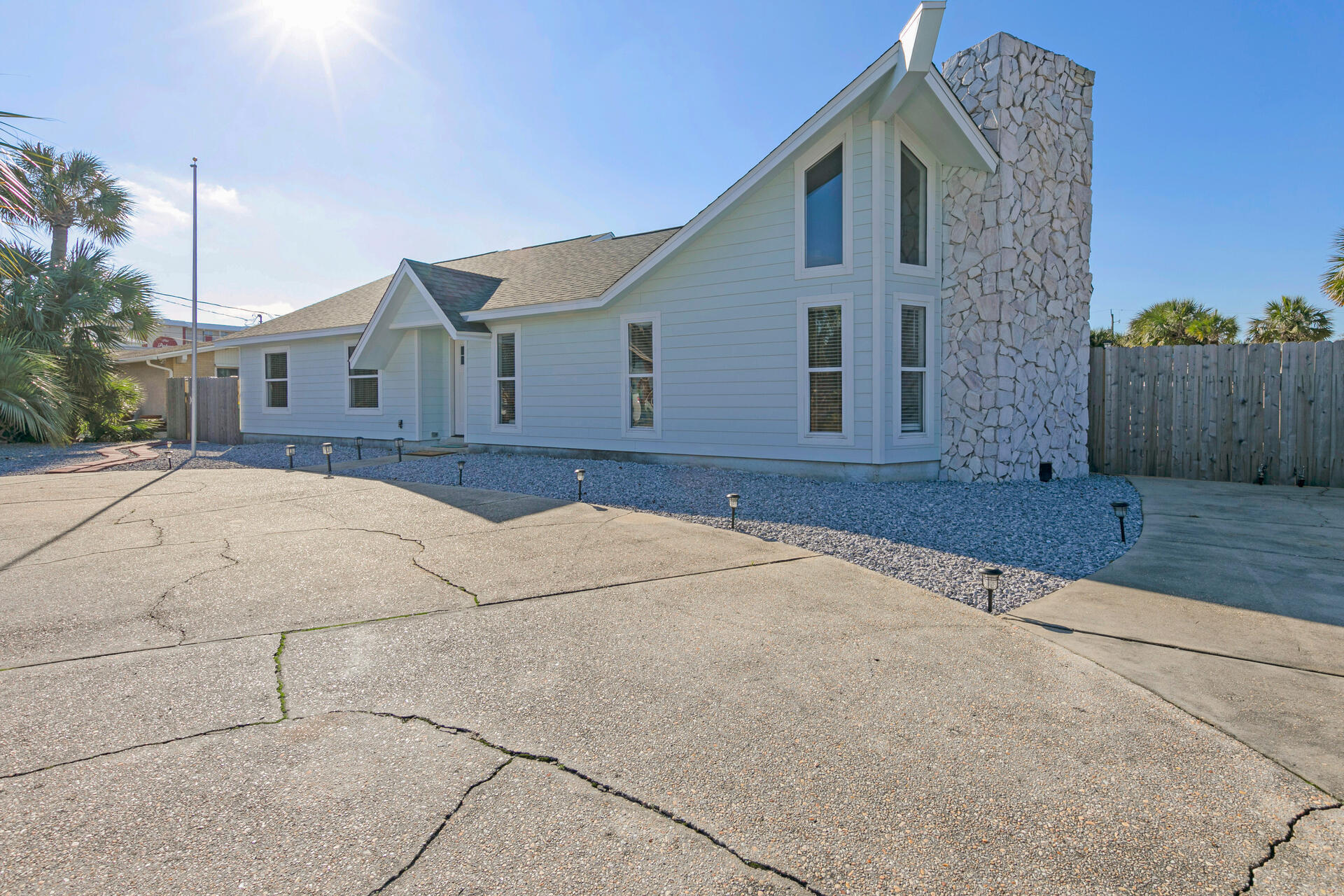 Welcome to 645 Porpoise! This one-of-a-kind, COMPLETELY REMODELED, 4 Bedroom, 3 Bath home boasts two kitchens, two washer/dryer hookups, and a mother-in-law suite. House has three french doors accessible to large, in the ground backyard pool from the main bedroom to the mother-in-law suite.   House is a block from the Ocean and a block from the Sound.  Ever wanted to live on an island?  Now you can...  Want to see the Sunset from the beach each night?  Now you can... Own a boat?  There are two boat launch locations just a few blocks from the house. Restaurants walking distance from your new home.  See weekly summer fireworks from your front yard – Welcome to Paradise!
