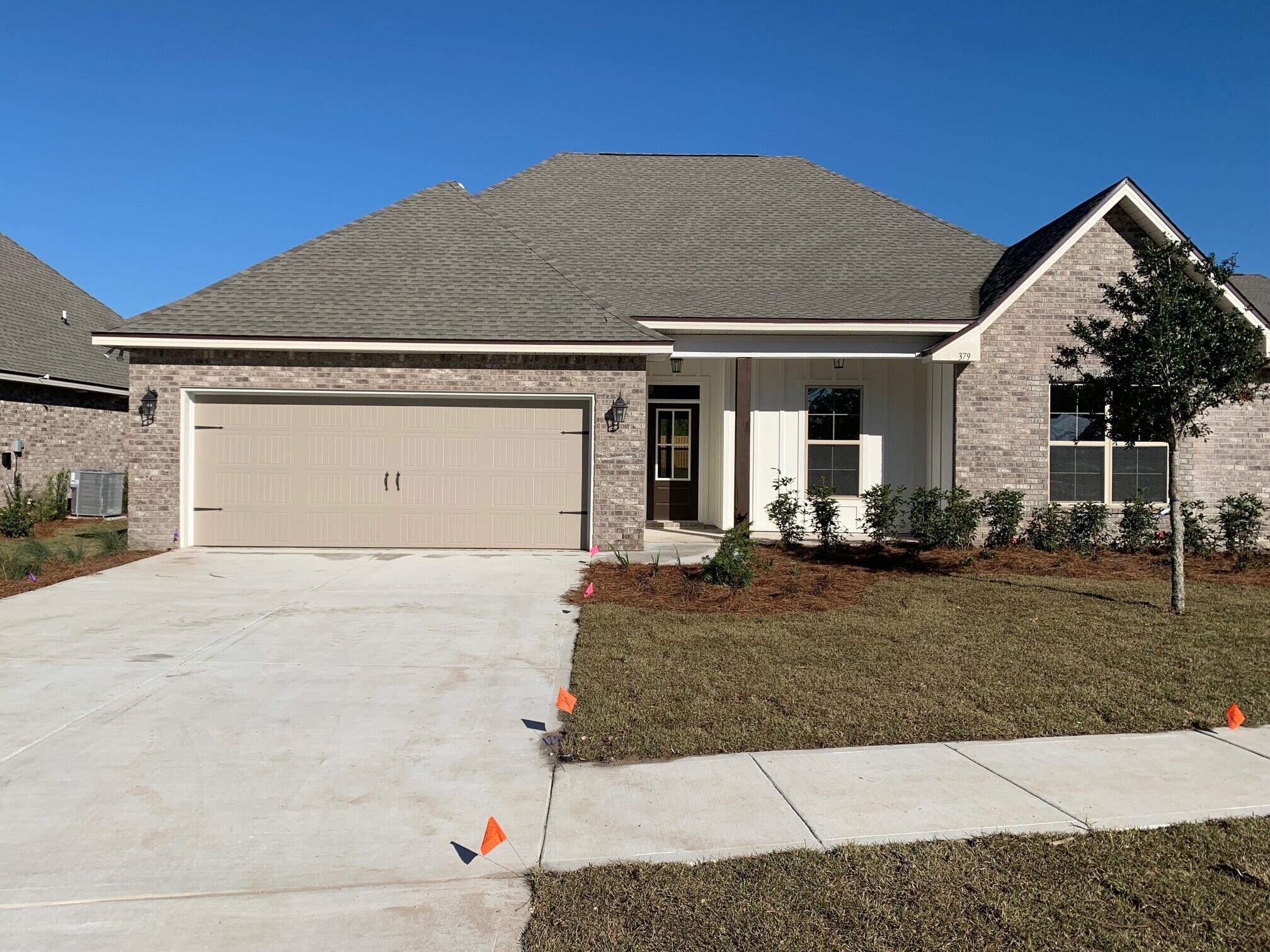 The CAMELLIA IV G in The Trails at Hammock Bay community offers a 4 bedroom, 2 full bathroom, with an open design. Upgrades include luxury wood look tile flooring, upgraded granite counters, upgraded cabinets and more! 
Special Features: Private water closet, double vanity, soaking tub, separate shower, walk-in closet in the master suite, covered rear patio, recessed can lighting, ceiling fans in living area and all bedrooms, framed mirrors for all bathrooms, undermount sinks, bronze plumbing fixtures, smoke and carbon monoxide detectors, garage door with hardware and two remotes, seasonal landscaping package, architectural landscaping package, 30 year shingles and more! Energy Efficient Features: Gas appliance package, Vinyl Low E MI windows and more!