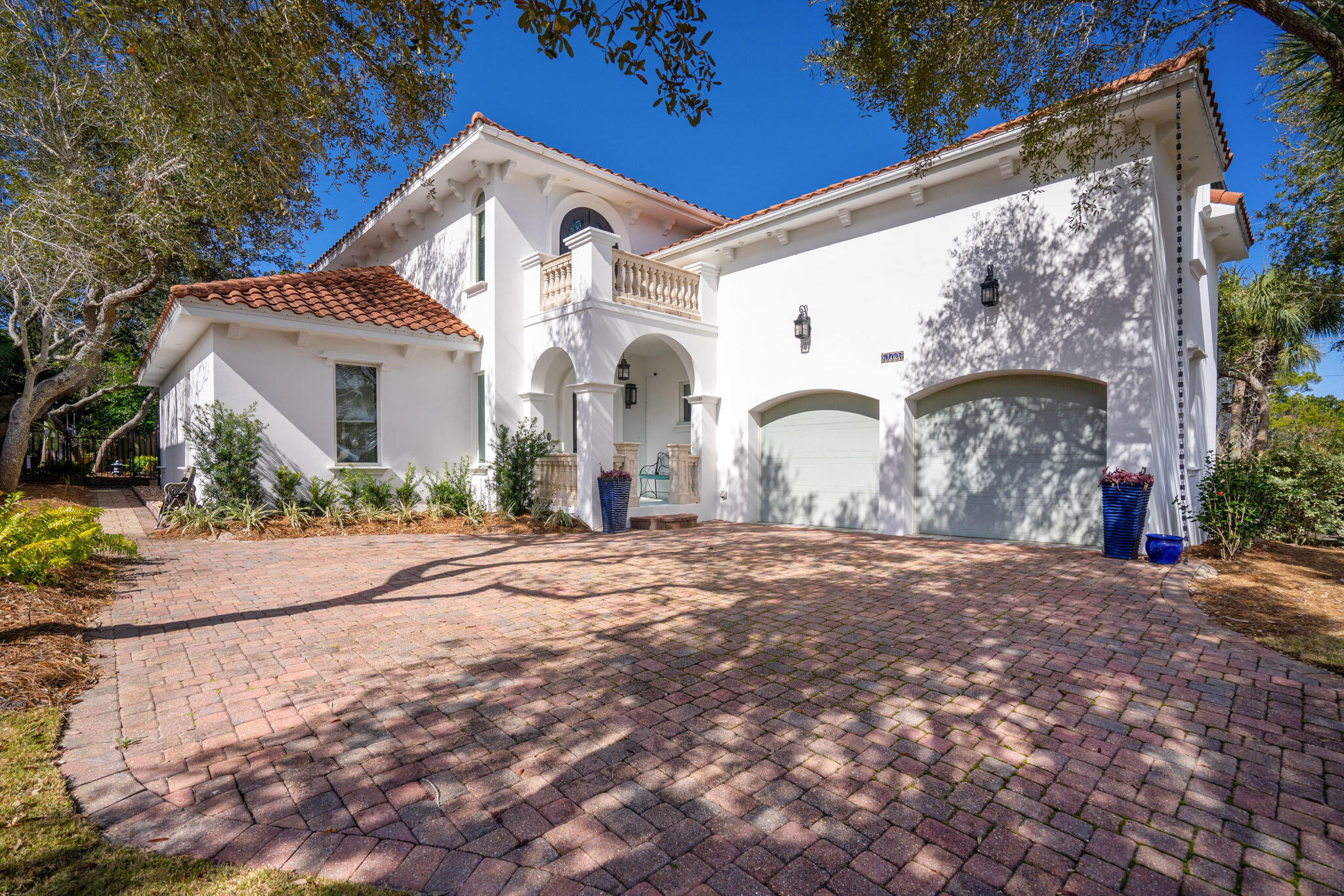 This amazing Mediterranean villa located in  One of Destin's favorite neighborhoods, Destiny West is a gated community situated directly across Scenic 98 from the stunning white sand beaches and sparkling waters of the Emerald Coast! Besides the beach, Destiny's amenities include a clubhouse, fitness center, swimming pool, hot tub, tennis, basketball court and gated access. 
This home provides luxury, conveniences and a practical floorplan well suited to modern lifestyles! Made of ICF construction and located on a cul-de-sac, The primary living area is on the first floor, plus the property offers incredible outdoor living, dining, relaxing, and entertaining spaces surrounding the gorgeous salt-water pool. The kitchen features two-tone granite countertops, solid cherry cabinets, glass backsplash, and stainless Thermador appliances including a 36" 6-burner cooktop, hood 42" built-in refrigerator, Sharp microwave drawer and a Uline wine refrigerator. The master suite is located on the first floor, as is a utility room with office space and a full bath. The main staircase leads to two bedrooms that share a bath and a balcony overlooking the pool.