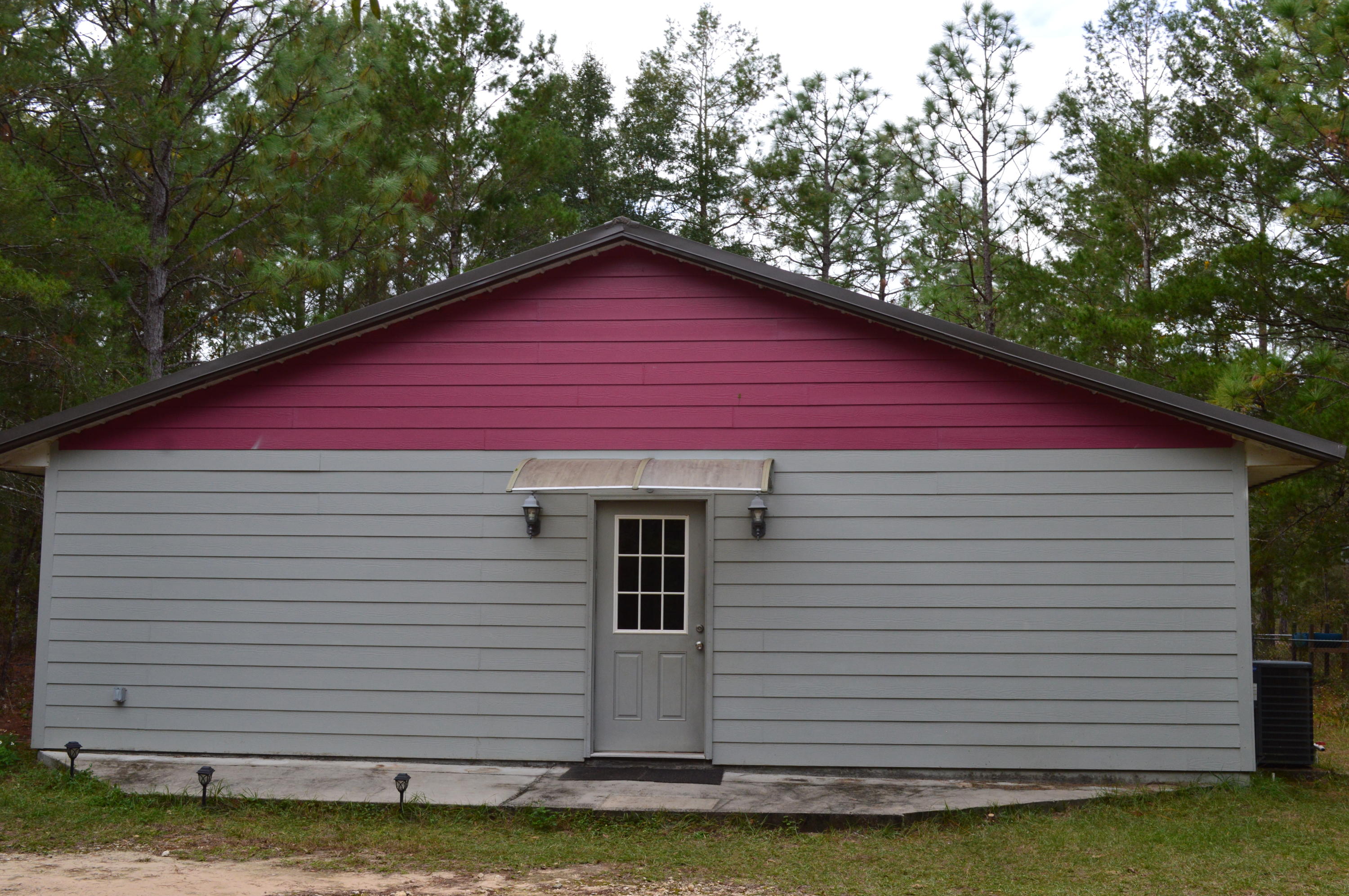 Practical and efficient 3 bedroom and 2 bath home on just shy of 2 acres in a private setting.  Home features 2'x6' construction, slab on grade with spray foam insulation throughout.  Roof and trim are 40 year manufacture warranty metal and siding is hardy board.  Split bedroom design with open concept kitchen and living room.  Master bedroom is spacious with ample closets and private master bath.  Home is tile throughout for ease of cleaning and maintenance.  Stained wood work throughout as well for  unique touches.  Property also features a carport and tool room along with a great 30' x 40' workshop with double doors and a great slab.  If you've been looking for a solidly built home with room to spread out and a workshop to boot....look no further!
