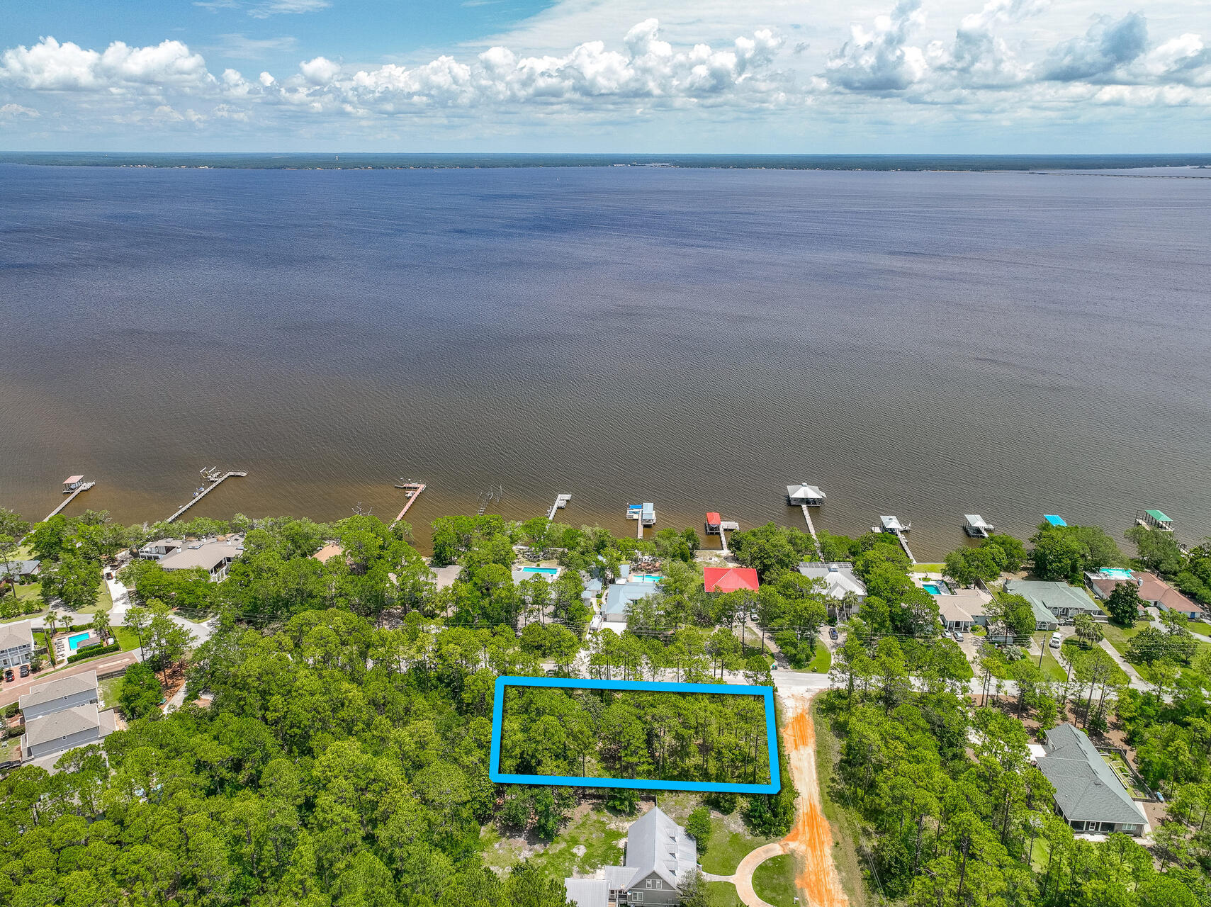 Discover the perfect opportunity to build your dream home on this spacious .51 acre lot.  Located, mintues to the renowned 30A area. Imagine the convenience of being just over half a mile from the serene, bayfront, Kellogg Park, ideal for tranquil strolls and picnics by the water. For boating enthusiasts, the Cessna Landing boat launch is a mere 3 miles away, providing easy access to the stunning waters of the Gulf. Additionally, the beautiful beaches are 5 miles away, making this location a prime spot for enjoying the best of coastal living. Embrace the vibrant lifestyle and natural beauty this area offers, and create your own oasis in this sought-after community.