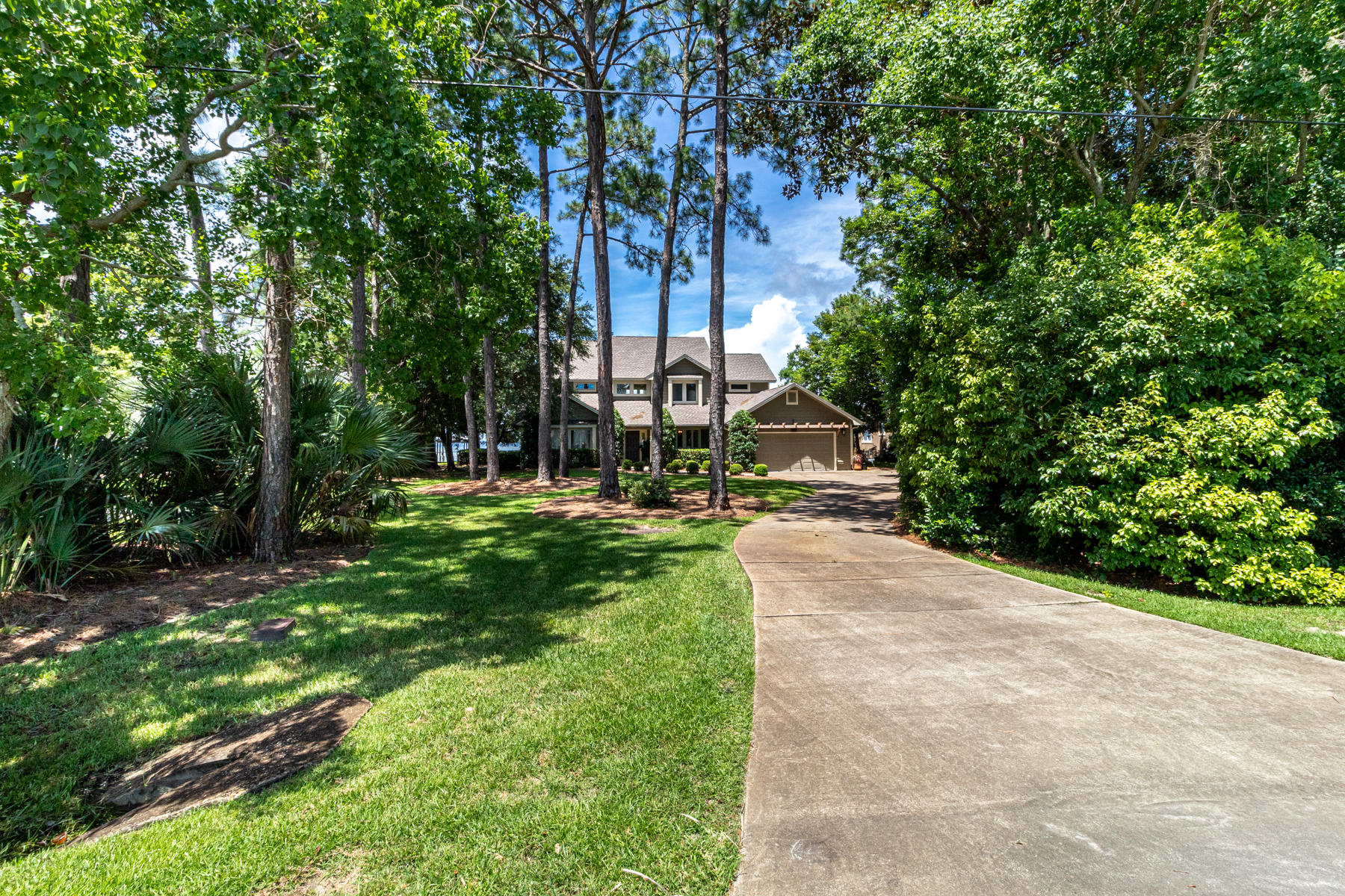 Bay Front Living, Outdoor Living, with the best location on the Emerald Coast...thats what 780 Shore Dr has to offer. Cedar Wood siding, travertine floors with an open floor plan for all the natural lighting you want. The Master Suite is on the main level with a den and an office. The guest rooms are on the second floor.
After you put your BOATS & the Jets skis on their LIFTS walk on the Thru Flo dock to the outdoor kitchen and jump in the HEATED pool, or hot tub, you can rinse off in the Pool house and enjoy the gas starter fire pit with a Jasmine wall for your privacy. New Roof in 2019, Brand new Culligan Rust Removal System and new pump on the well for the irragartion New Pool Tile
Under Cover Boat lift 32'(18 tons). Second boat slip will hold sail boat or any vessell up to 25ft