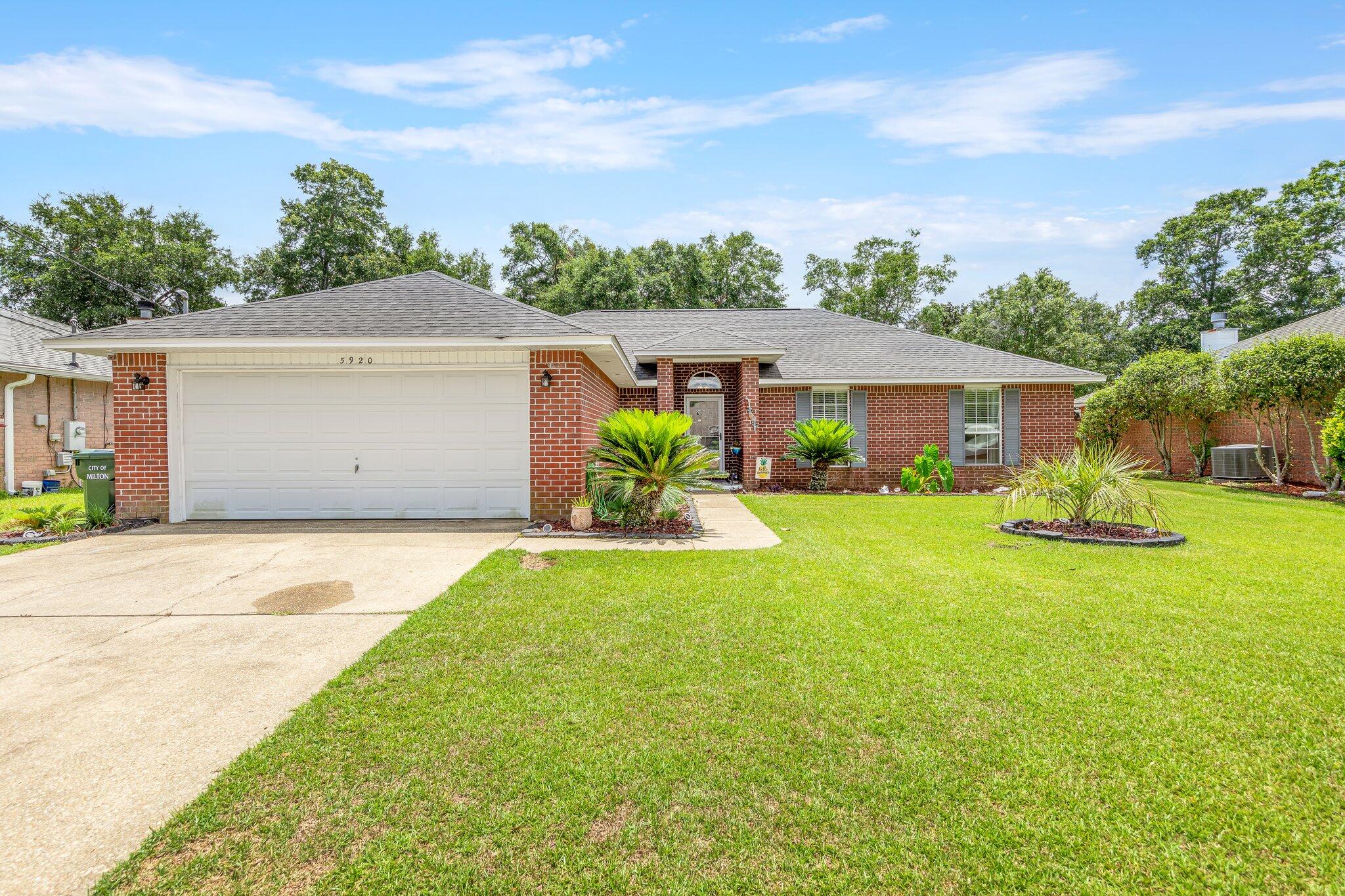 Gorgeous 4/2 Brick home on elevated lot in ASHTON WOODS SUBDIVISION-NO HOA!  Featuring refreshingly oversized kitchen with a center island - extra workspace, all stainless steel appliances, stunning granite countertops with breakfast bar + walk-in pantry. Boasting a true split bedroom floor plan- master suite with walk-in closet, double vanity, separate shower and garden-tub. On the other side of the home you will find three nicely sized bedrooms and a second full bathroom. All living spaces beautifully covered with wood grain laminate flooring, while the kitchen and all wet areas are tiled! Relax inside or outside by the fire place or firepit. Plenty of backyard space to play, entertain, or install a pool!
New Roof 2020-New HWH-2020-NEW HVAC-2019-pull down stairs for attic access in grg.