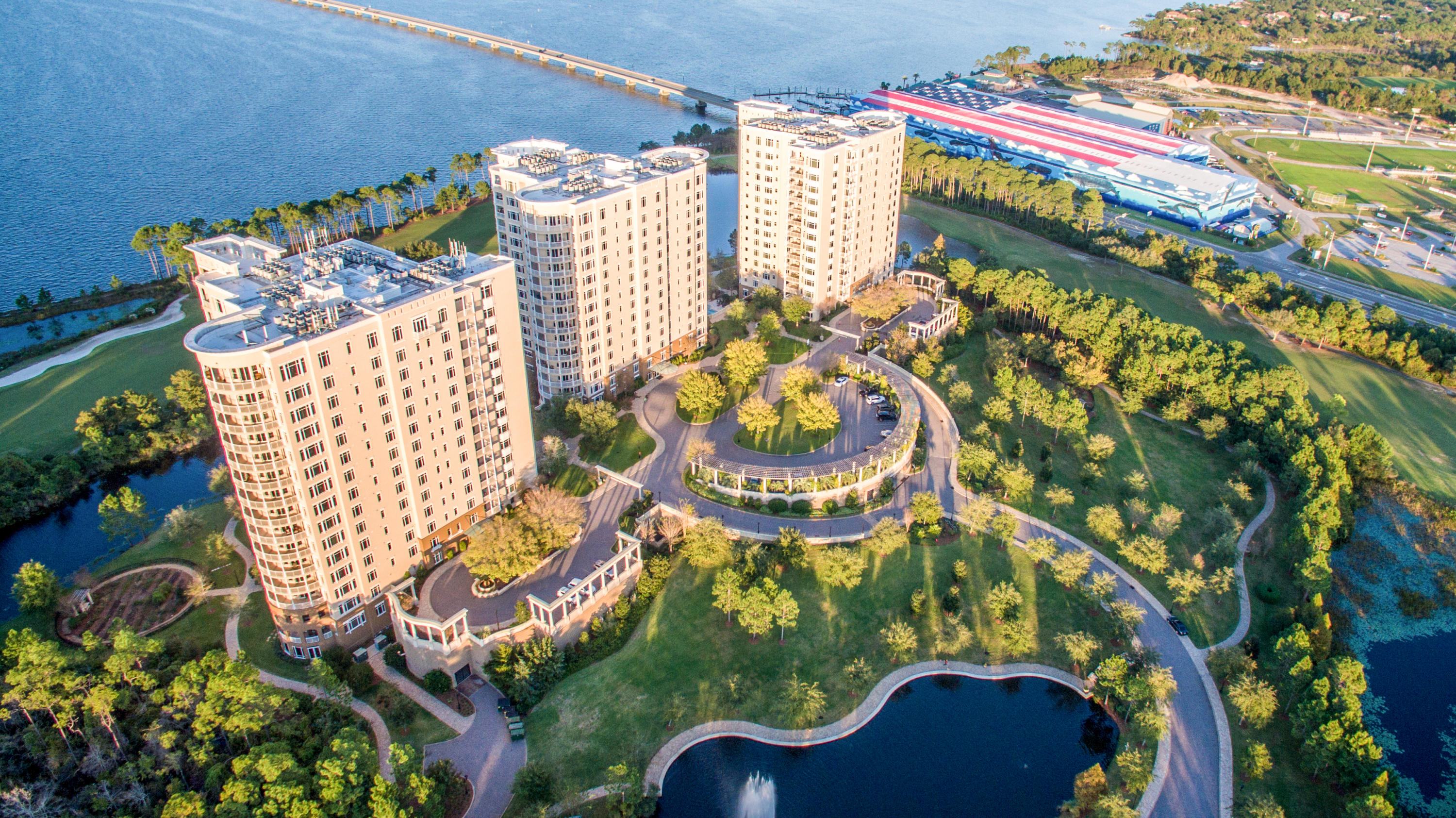 A fabulous, fully furnished higher-floor unit in Destin's luxurious condominium residence, One Water Place, with excellent views of the Choctawhatchee Bay, Fred Couples Signature golf course, acres of natural foliage, as well as Destin and the Gulf. Located in the newest building, Building 3, this unit features the spacious Darlington floor plan. Some of the highlights include having both a living room and family room (or study/media room as you prefer) with fireplace, views from 3 sides of the master bedroom, and double doors to the 2 additional bedrooms, which gives the feel of a guest wing or separated office arrangement The huge kitchen has granite countertops, stainless steel appliances, and rich wood cabinetry, plus a pass through to the formal dining room. Baths also have granite countertops, and each bedroom has its own bath. This unit enjoys 3 decks--2 large enough for sitting and/or dining and a small balcony facing the bay from the master bedroom. Plus all bedrooms have fantastic views--with elegant window coverings if you choose to block out the sunlight. The master bath is enormous: 2 separate counters and sinks, a large airtub with window facing the bay, large walk-in shower, plenty of room for dressing, and huge walk-in closet.

One Water Place units offer a private elevator entrance, secured building, covered parking, and numerous amenities, including outdoor pools, indoor and outdoor spas, a full fitness center, locker rooms, game room, theater room, gorgeous lobby, gardening facility, boardrooms, etc. In addition, Kelly Plantation offers a golf course, clubhouse, stables, and much more! The best of the Emerald Coast awaits you in this ideal, relaxed setting in an excellent central Destin location!