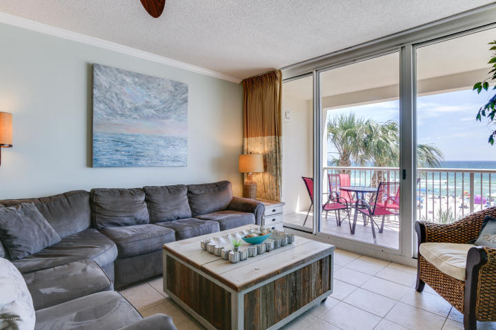 This one of a kind, coveted 4bed/3bath unit in the desirable Majestic Beach Resort condo is the thing of which dreams are made. Almost 1600 square feet of seaside luxury with a toes-in-the-sand location on the stunning beaches of Panama City Beach. It lives like a beach house but comes with all the benefits of owning a condo. An exclusive L-shaped balcony is accessed from the living room and master suite providing the ultimate alfresco living and entertaining environment...it is the only balcony in the development that overlooks both the Gulf and Pool area! Located on a corner of the 2nd floor of the magnificent Majestic Beach Towers I, this condo features has been completely remolded and offers custom touches such as tile floors throughout, custom paneling on breakfast bar,