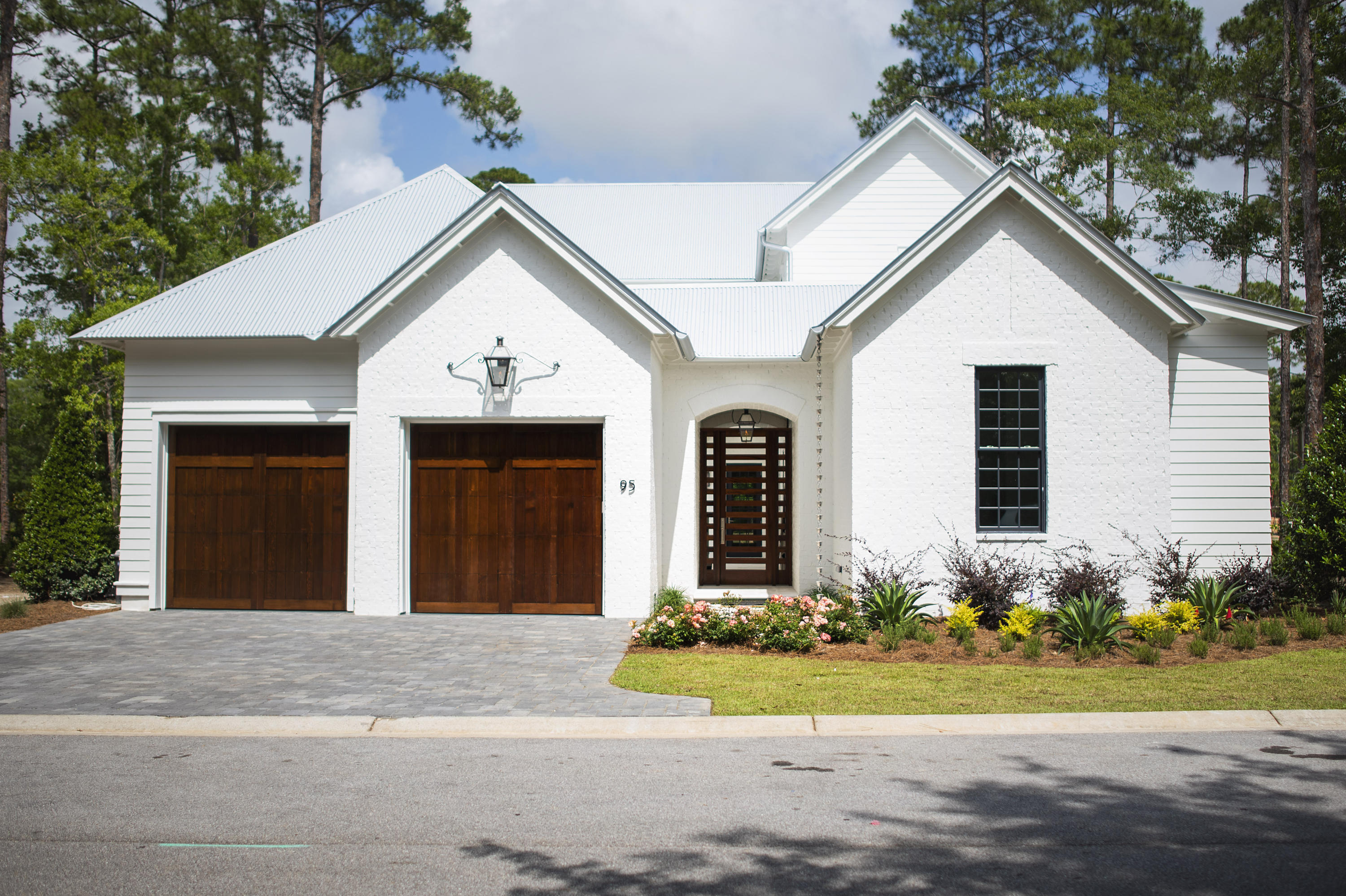 Newly completed within the gated Churchill Oaks neighborhood - This stunning Magnolia plan is designed by Savoie Architects and is situated on a beautiful spring-fed lake offering 4 bedrooms with the master on the main level, 4 and 1 half bathrooms, a 2-car garage with hardwood white oak floors, tongue-and-groove kitchen ceiling and Venetian plaster accent walls. The private courtyard with a pool, summer kitchen, loggia and lounge area offer endless summer fun without ever leaving home. The spacious first floor features an open living area centered around a modern ribbon fireplace and grand dining room with a full wet bar. The chef's kitchen overlooks the courtyard and dining area with beautiful quartz counters, slab cabinets, Thermador appliances + more high-end finishes. Tucked away amongst native vegetation and the calm waters of Hogtown Bayou, Churchill Oaks offers a lifestyle of elegance and appreciation of nature. Once inside the stately gated entrance, magnificent coastal homes accentuate southern architecture under a canopy of old oak trees. The 40-acre community is comprised of 87 homesites and some of the best amenities in South Walton. The Churchill Oaks Clubhouse is an outstanding 8,000 square foot amenity situated on a point on the Bay with stunning views. Three pools, exercise room, outdoor bar, fully equipped media room, commercial grade kitchen, bath and locker rooms, and large gathering spaces are all found at the Clubhouse for owners and their guests to enjoy. The latest to the community is a deep-water, private marina. The marina project includes 36 private boat slips, paddle board storage decks, a fish cleaning station, shoreline stabilization + more! Please verify with on-site agent the total New Buyer fees due at closing.