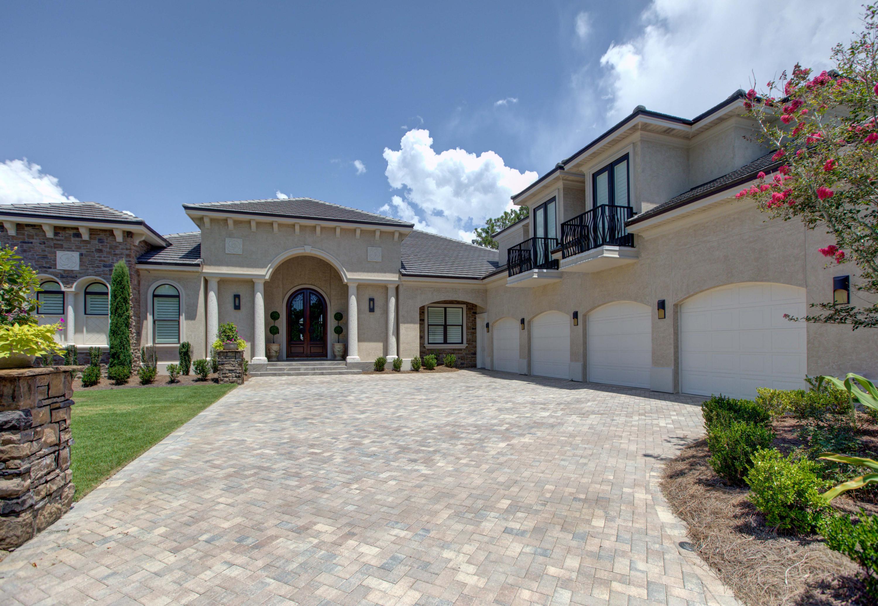 One of a kind custom built estate home offering amazing unobstructed views of the Choctawhatchee Bay and the 13th fairway of the Burnt Pine Golf Course. A unique opportunity to own one of the most luxurious residences in the area, perfectly situated within the gates of Burnt Pine. A dream home for the wine enthusiast, this home features a truly custom wine cellar which includes an area for tasting, ample racking and storage, and state of the art cooling system. Entertaining is easy and enjoyable thanks to the separate bar area just off the kitchen, formal dining room, and outdoor living space. The lanai is climate controlled and features a full outdoor kitchen including a Dacor grill, Alfresco two burner stove, Bosch dishwasher, warming drawer, refrigerator, and ice maker. Guests are comfortable inside and out, as the casual great room seamlessly flows to the lanai.  Enjoy waking up to the serene bay views from the Master Suite, with spa like bath which includes a separate dressing room, makeup area, claw foot tub, and two water closets.  The kitchen features Wolf double ovens, Wolf 6 burner gas cooktop with griddle, Bosch dishwasher, Subzero refrigerator, and built in eat in kitchen.  The Sports suite upstairs for all of your memorabilia houses a full bath as well as mini-kitchen. Car collectors will appreciate the 4 car garage which is climate controlled complete with work benches and built in cabinetry for your tools. The finest craftsmanship with attention to detail throughout such as venetian plaster, barreled ceilings, pool with built in benches and waterfall, hot tub, and built in fire pit.  Too many features to list, a must see for the most discriminating buyer!