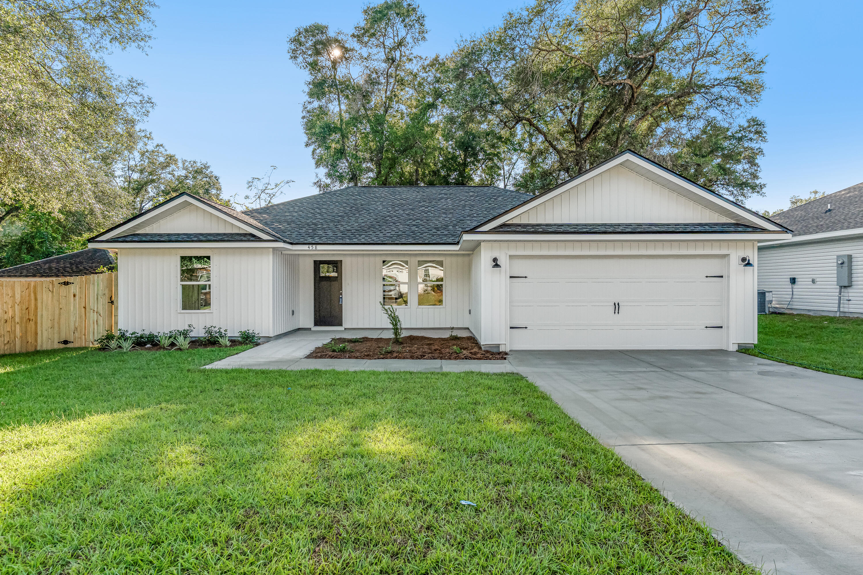 READY NOW - ASK ABOUT 4.99% INTEREST RATE + CLOSING COSTS OR $15,000 FLEX CASH - Big features in this smaller home include raised ceilings, recessed lighting, luxury vinyl plank flooring throughout, quartz or granite countertops, white shaker cabinets plus stainless-steel appliances.  Finished 2-car garage, cozy front porch and patio in rear.  True split bedroom plan with open family/dining/kitchen area.  All vinyl home with beautifully landscaped yard & privacy fence.  Photos are of similar completed home, colors (interior/exterior) and front elevation may vary.