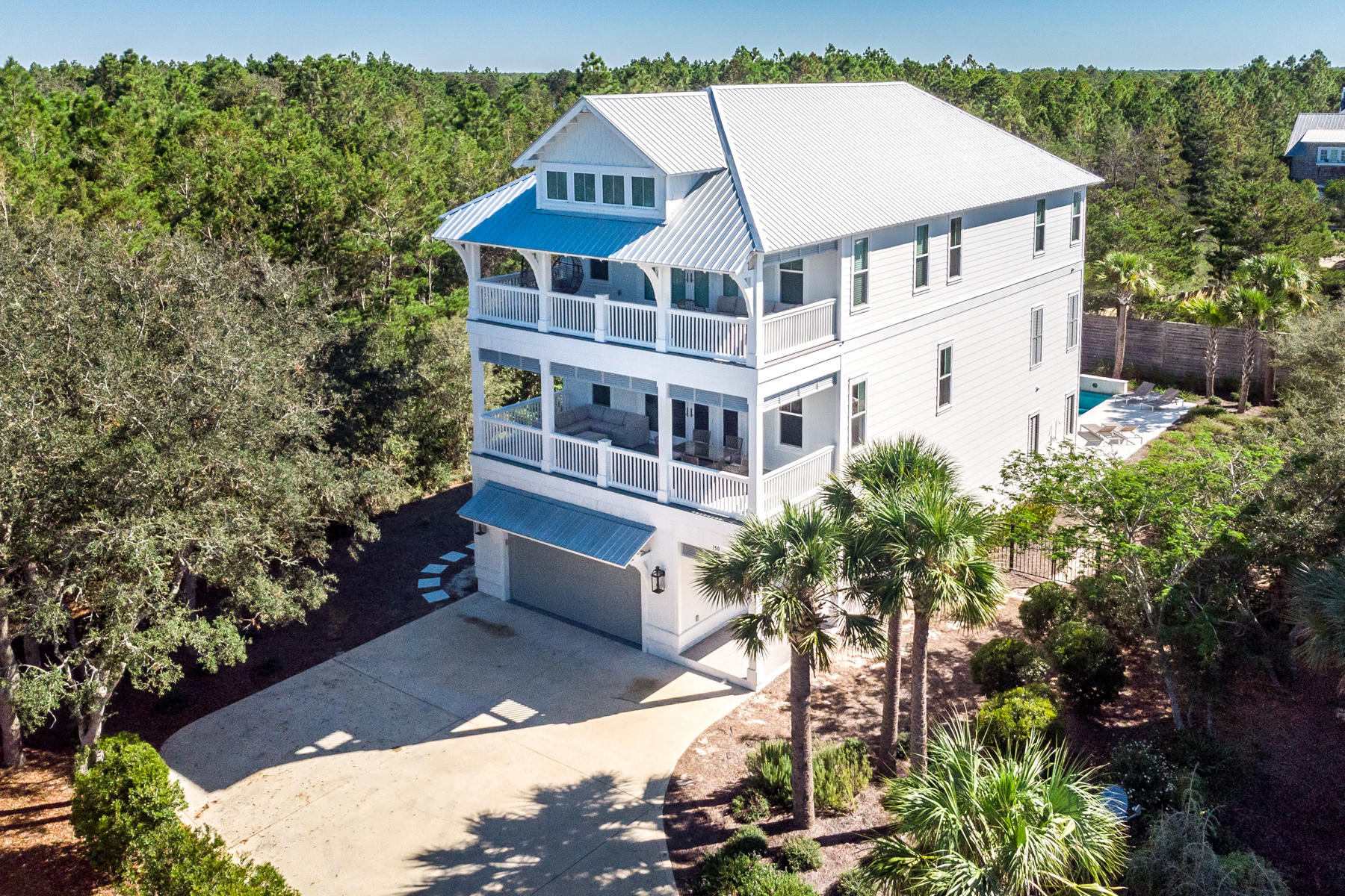 Beautiful, fully-furnished and semi-private home on oversized 1/4 acre lot adjacent to Camp Creek Golf Course in Seacrest with deeded beach access!. Built in 2018 by Cogent builders, this 5 bedroom home features on the ground floor a two car garage (golf cart included) with epoxy floors, a private pool, a fire table, and a large, screened entertaining area complete with summer kitchen and TV. Inside on the first floor, you'll find a generously sized bedroom with full bath, laundry room and a private elevator leading to the second and third floors. On the second floor is where family and friends gather in the open concept kitchen, living, and dining areas to laugh, watch games, and share stories! a 36' six-burner range, dual ovens, dual dishwashers, and beverage fridge. Looking up, you'll find beautiful coffered wood-work and details to enjoy. Of the living space, the 12' deep and 31' wide deck provides plenty of space to hangout and entertain. On the second floor you'll also find a half bath for guests, and another bedroom with ensuite bathroom. Venturing up the stairs or elevator to the third floor, we find another bedroom with ensuite bath, a 4-bed bunkroom with ensuite bath for the kids (or the kids at heart) and the Master Suite! Featuring the same size - 12' deep and 31' wide balcony as the living room, this one offers glimpses of the gulf and is private just to the Master bedroom. The master bathroom is absolutely BEAUTIFUL with wonderful tilework, large, frame-less, glassed-in shower and tub combo, and large walk-in closet. 
All information is deemed correct, but should be verified by buyer.