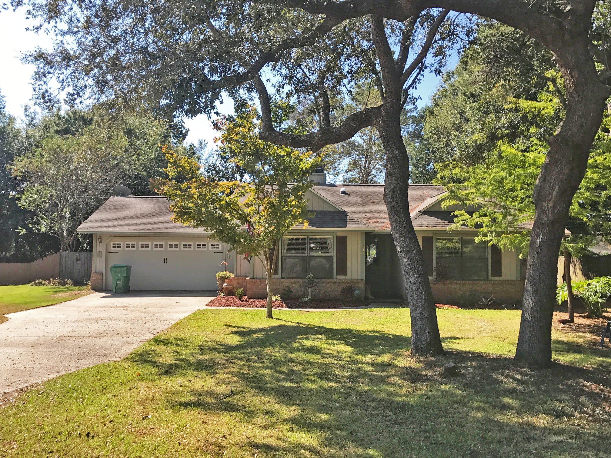 Wonderful home with a functional, flowing floor plan. As you walk in, you are greeted by a skylit living room. To your left is the formal dining room that wraps around into the kitchen. Granite counter tops complete with a breakfast bar, deep under mount sink, and plenty of cabinet space. Off the kitchen is your master suite and entrance to the garage. Around the kitchen is a breakfast nook that overlooks the spacious living room with a fireplace as the focal point. French doors lead you out to the Florida room complete with cedar-plank ceiling. Back through the living room and through the foyer are your three additional bedrooms and a full hall bathroom. Huge fenced-in backyard with yard building and greenhouse.