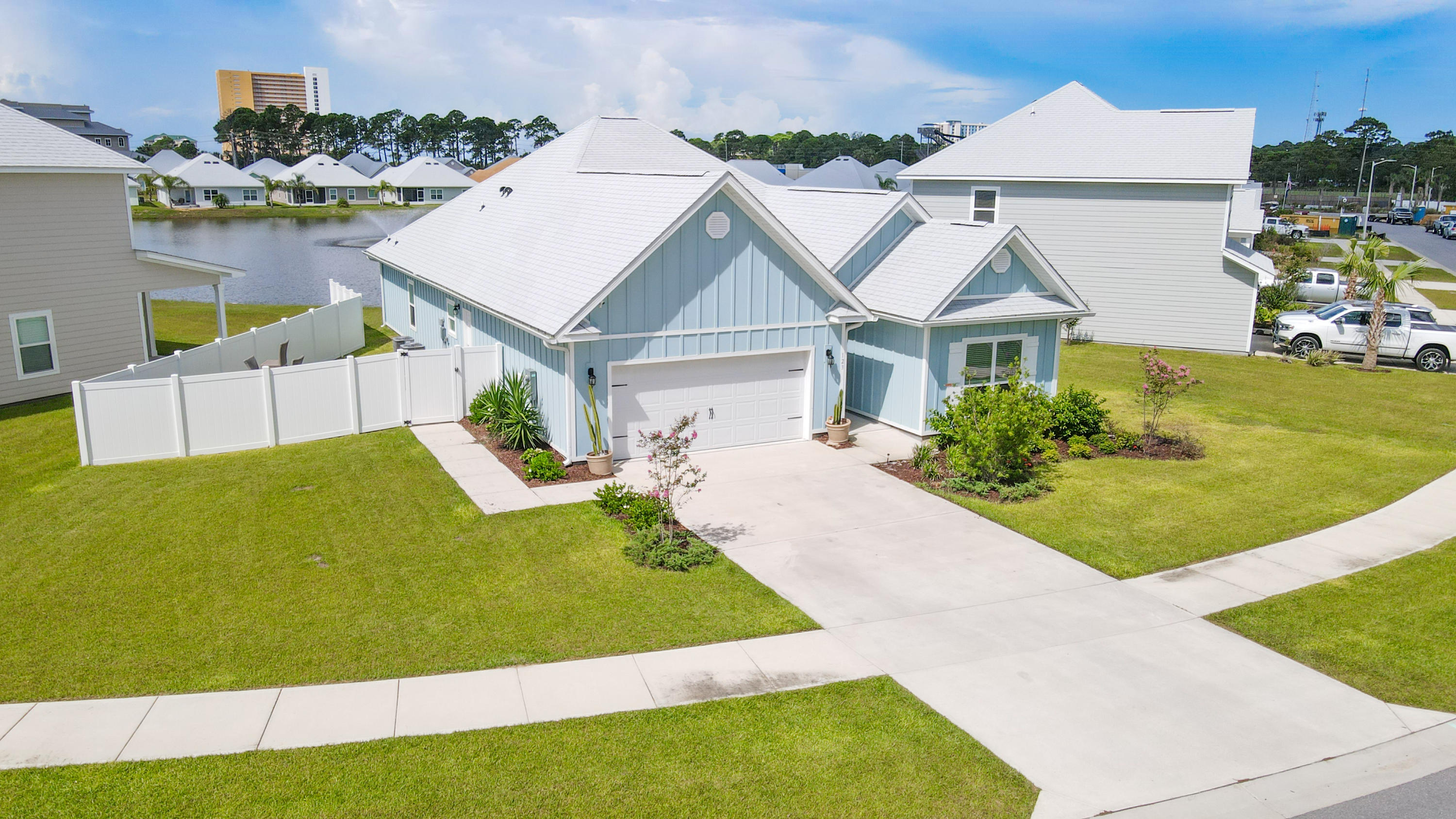 Largest lot, sitting on the lake in this beautiful newly constructed neighborhood. The Kennedy floor plan is a multi-generational offering a separate mother in law suite with separate entry with full kitchen, living and dining area, full bath, laundry room and bedroom controlled by own thermostat. This home has 9's ceilings throughout, LVP flooring throughout entire home and plush carpet in the front two bedrooms. Additional features of this home include, blinds throughout, brushed nickel hardware on interior doors, beautiful light painted cabinetry in the kitchen, QUARTZ countertops, designer lighting package and recessed lighting. The main living are of this home has an open kitchen with center island and a standard appliance package that includes a stainless stove, refrigerator, microwave,dishwasher, washer and dryer. Screened in porch. Irrigation system and Fire Pit. This is also a Smart Home, which is a standard package that includes an Qolsys touch panel, Kwikset keyless entry and Skybell doorbell.