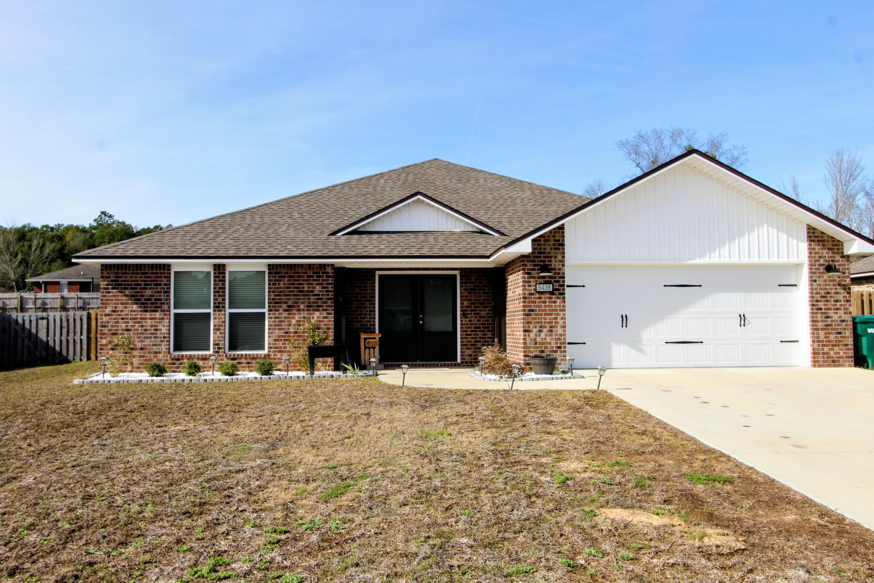 Welcome to 5438 Lee Farm Blvd in Crestview, FL—a stunning 4-bedroom, 2-bath home offering 2,200 square feet of modern living space, built in 2024. Designed with both style and functionality in mind, this like-new home features an open-concept layout filled with natural light, ideal for entertaining and everyday living. The spacious kitchen flows seamlessly into the main living areas, while the split-bedroom floor plan provides privacy and comfort. The primary suite offers a relaxing retreat with a well-appointed bath. Convenient access to shopping, dining, schools, and military bases, this home blends modern construction with everyday convenience.