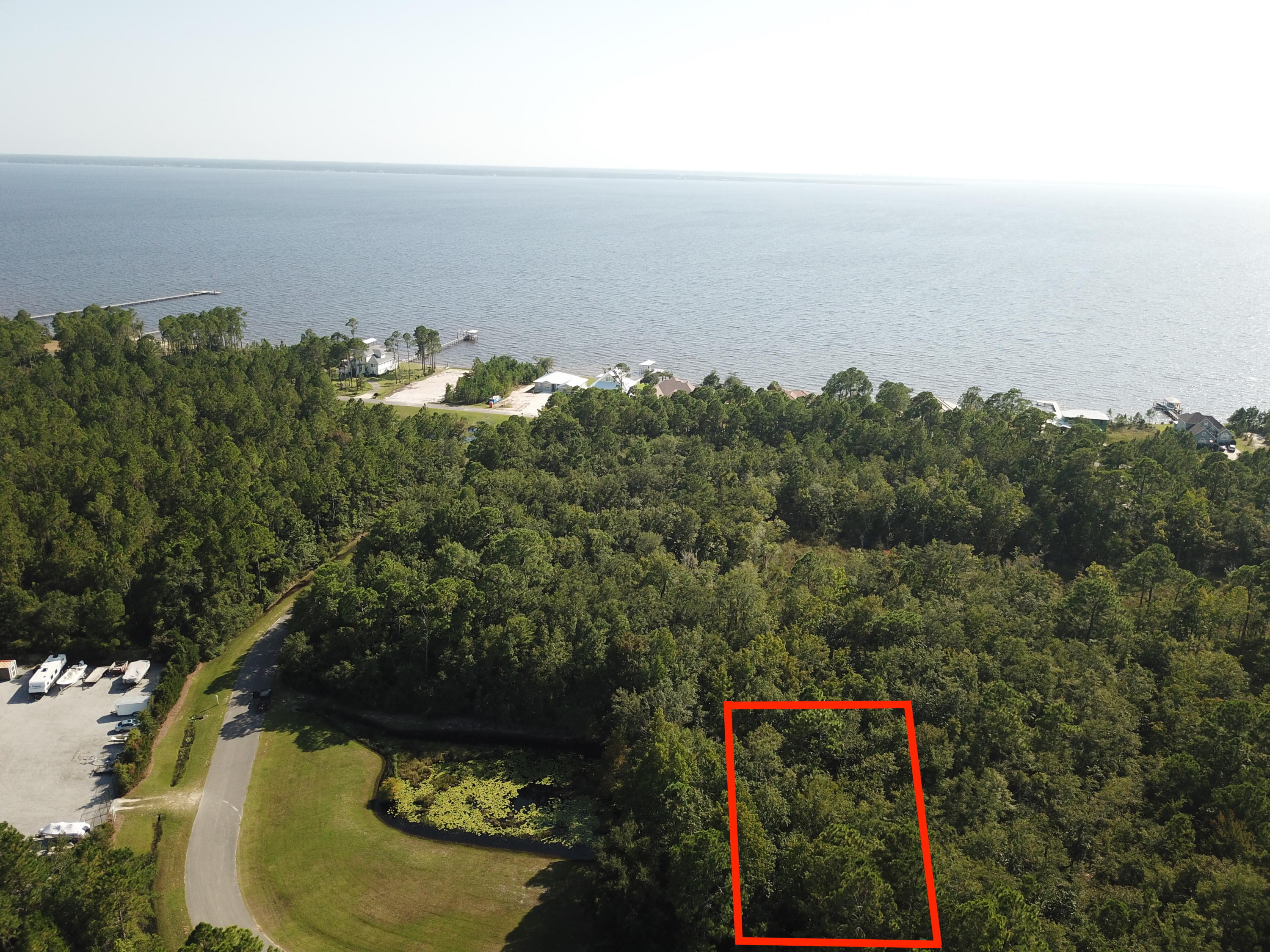 Build your bayside dream home on one of the largest oversized lot in Bay Harbour.  Quite private neighborhood with many stunning custom homes currently being built. Bay Harbour features community dock, tennis court, boat Storage, and acres Of preserved areas To enjoy the outdoors. Lot 67 adjacent to the property can be purchased together or separated.