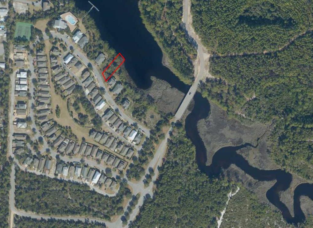 Welcome Home to Turtle Cove at Lake Powell. This waterfront lot offers wonderful views of Lake Powell a coastal dune lake and treasure to the community of Bay county.  Turtle Cove is a great community and now is a great time to purchase your dream lot to build your dream home.  Buyer to verify dimensions.      Turtle Cove at Lake Powell is located on the west end of Panama City Beach at the entrance to Wild Heron.  This neighborhood offers easy access to the beach, Lake Powell, 30-A dining and entertainment.  Neighborhood features include community pool, exercise room, community room, tennis courts, and dock on Lake Powell.