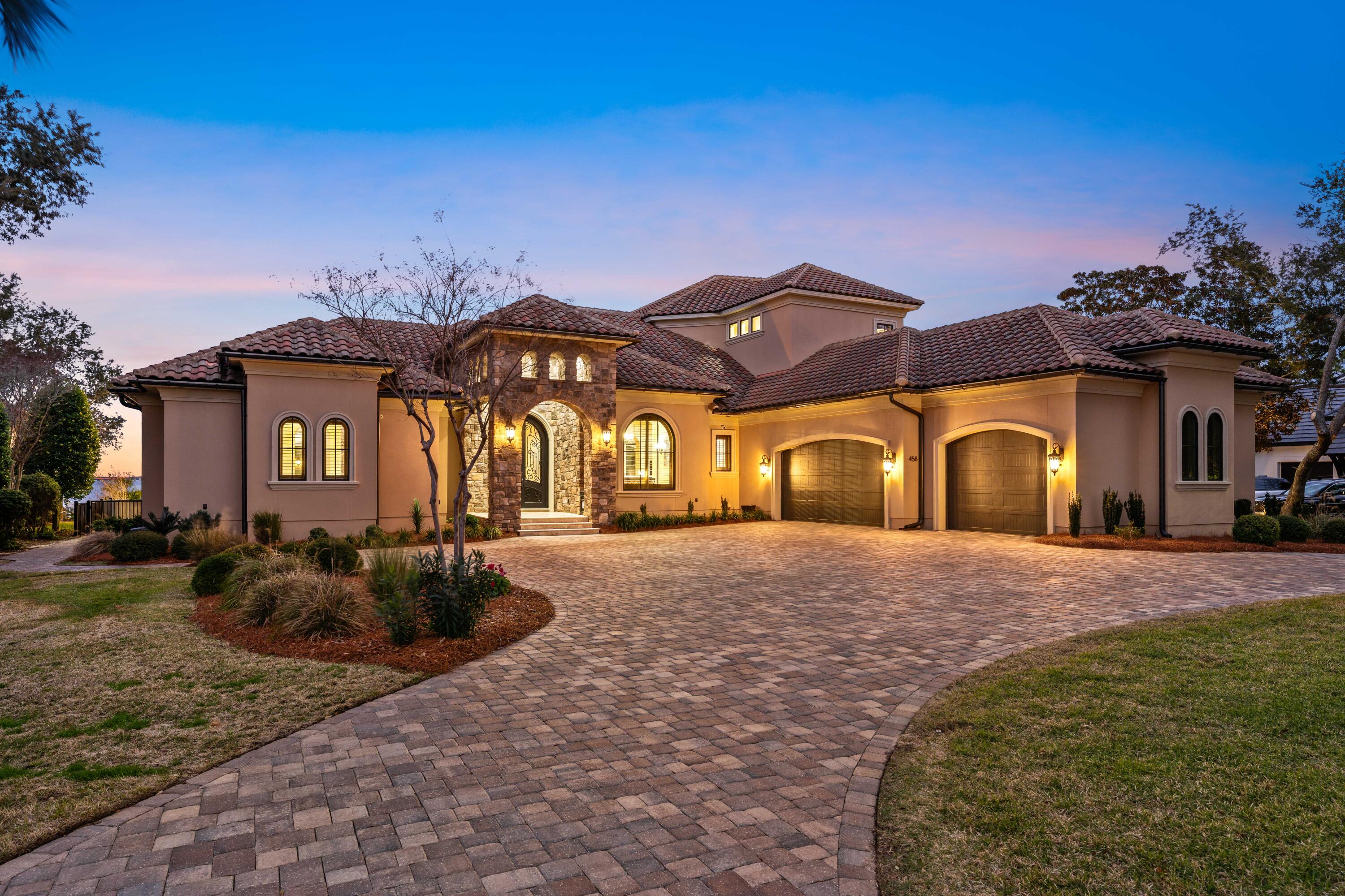 Built by DKM Custom Homes in 2018. This beautiful bayfront home offers a rare opportunity for anyone looking for quality, comfort, and truly breathtaking views. This masterpiece residence welcomes you with an impressive circular paver driveway and stunning 12-foot handcrafted metal front doors with glass inlays.
Inside, the grand entry features16-foot ceilings, elegant crown molding, travertine stone floors, and beautifully finished walls. Straight ahead, the main living area opens effortlessly to the dining space and cabana bar, an ideal layout for entertaining while taking in peaceful pool and bay views.
The west wing of the home is designed for privacy and relaxation. Just off the main living area is a dedicated study or office, followed by the spacious primary suite. The owner's retreat includes a professionally designed walk-in closet and a spa-like bathroom with dual granite vanities, custom cabinetry, a whirlpool tub with extra back jets, and a walk-in shower with body sprays. The bedroom itself features engineered hardwood floors, tray ceilings, stunning bay views, and direct access to the lanai, pool, and spa.
On the east side of the home, the chef's kitchen is both beautiful and functional, equipped with Wolf appliances, a Sub-Zero refrigerator/freezer, a large island with prep sink, walk-in pantry, custom cabinetry, granite countertops, and a striking cast-stone vent hood. The kitchen flows into a casual dining area and a comfortable great room with a Heat & Glo fireplace and sliding glass doors that lead outside.
The outdoor living space is where this home truly shines. Enjoy a saltwater pool and spa, tanning shelf with fountains, a full summer kitchen, spacious backyard.  The panoramic five-mile bay views including the Mid-Bay Bridge are absolutely incredible.
Back inside on the main level, you'll find a guest suite, full laundry room, and a staircase with custom metal railings. Upstairs offers a large recreation room with a 5.1 surround sound system, mini kitchen, half bath, and a balcony with gorgeous water views. Two additional guest bedrooms share a bath, and there's plenty of walk-in attic storage.
Additional highlights include inside the garage mounted, tankless water heaters, central vacuum with retractable hoses, integrated security and surround sound wiring, Control 4 home automation, and a Generac 22kW generator. The oversized 3.5-car side-entry garage features epoxy floors, built-in cabinets, attic storage, and hurricane-rated aluminum garage doors. 
Constructed in 2025, custom manufactured 880 SF. boathouse, extending 83' from the bulkhead, capable of housing a 39' boat. The boathouse is engineered for saltwater environments and consists of:
Fully enclosed and painted ceiling beneath the roof.
20,000 lb. E-Drive boatlift with non-metallic control box and remote control.
Swim deck platform with stairs utilizing composite Thruflow material.
Entire walkway utilizing composite Thruflow material.
Owens Corning structural composite lumber and piling furring strips used throughout the dock.
Protective, black polyethylene piling wraps are installed on the lower sections of all pilings.
Countersunk, piling mounted, marine bronze integrated L.E.D. pathway lighting operated by a stainless-steel transformer and non-metallic photocell.
2 custom manufactured, 7' -0" long, structural composite lumber dock boxes with locks.
2 custom fabricated dock box covers.
1 custom manufactured, 7'-0" long, structural composite bar top with lower storage.
¾" schedule 40, 316L stainless steel dock water supply piping and valves with multiple low point bleeds.
Non-metallic freshwater shower.
Flush mounted, non-metallic, integrated LED light fixtures throughout the boathouse. 15-amp waterproof receptacles.
Located in the gated community of Regatta Bay, residents enjoy access to an 18-hole golf course, tennis and pickleball courts, community pool, playground, and a grand clubhouse all just minutes from the marina.