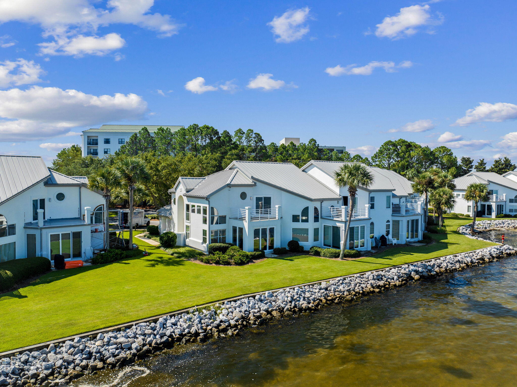**Now offered fully furnished!** Welcome to your dream retreat, nestled in the highly sought-after Northshore enclave of Sandestin Golf & Beach Resort. This bayside gem offers an unbeatable location, delivering serene, panoramic views that will make every day feel like a vacation. Imagine waking up in your tranquil primary suite, where the view feels like you're floating over the bay. Picture-perfect sunsets and calming waters are your daily backdrop. Step into a grand living space, where soaring ceilings and an abundance of natural light from the multitude of windows create an inviting atmosphere. The original floor plan has been masterfully reimagined by removing the landing and expanding the living area into what was once a rear screened porch—now an enclosed extension of the great room. The result is a space that feels even more open and connected to the breathtaking bay views outside. The kitchen has been completely updated with new countertops, backsplash, and custom built-in cabinetry, making meal preparation a joy. All bathrooms have been recently refinished with stunning new showers, adding a touch of luxury to your daily routine. Crown molding has been added for an extra touch of sophistication and the home has been freshly painted inside and out. The layout is perfect for family and guests alike, offering two bedrooms and two baths on the main floor, including a second primary. The upstairs primary suite is your private sanctuary, complete with a large balcony where you can soak in the beauty of the bay. As one of the few Northshore properties that includes a private, oversized one-car garage, this townhome stands out. The garage comes with a golf cart, perfect for exploring the resort, and has ample space for bikes and other recreational gear. This townhome is also located in a quiet part of the resort, offering the perfect blend of seclusion and convenience. The Northshore community has recently undergone major upgrades, including new roofs, enhanced landscaping, and a new seawall. Whether you're fishing from your backyard, launching a paddleboard from the private bayside beach, or simply unwinding on your master balcony, this townhome offers a lifestyle like no other. Don't miss this remarkable opportunity to own a piece of paradise in one of Sandestin's most coveted locations.

Inside the gates of the resort, everything is accessible by golf cart or bicycle, interconnected by miles of pedestrian, bike, and golf cart paths. These paths weave through groves of live oaks, natural lagoons, fountains, man-made lakes, and meticulously landscaped fairways, offering a serene and picturesque environment. Sandestin Golf and Beach Resort, encompassing over 2,400 acres from the beach to the bay, offers abundant amenities. Enjoy four championship golf courses, fifteen world-class tennis courts, a full-service 226-slip marina, and scenic biking and hiking trails. Indulge in celebrity chef dining and shopping at The Village of Baytowne Wharf, Grand Boulevard, and the Market Shops of Sandestin. The resort also features a full-service spa, ensuring a perfect balance of relaxation and activity.