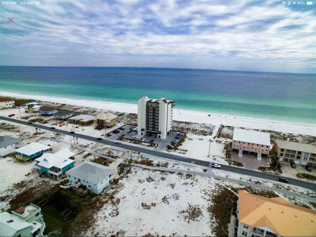 Incredible Opportunity to One-of-a-kind residential lot in beautiful Navarre Beach! One of the most desirable beach communities. Only one remaining, directly across from the Gulf and full unobstructed views. Bay views in the rear of the lot. Lot size is 90' X 125'. No HOA fees. No build out period. Right in front of your house, walk to the emerald green waters of the Gulf of Mexico. Incredible opportunity to build your dream home, vacation rental or second home with breathtaking views of the Gulf and Bay. Walk our your front door and on to the beach! Beach front lots costing several hundred thousands more. You can have the best of both worlds. Watch the sunrise and sunset from your front deck or on the beach! Walk or bike to the National Sea Shore. Enjoy local restaurants, bike and walking paths. Close proximity
to Pensacola (PNS) and Fort Walton (VPS) regional airports Lot 14 offers a 1/4 acre with 90' frontage of the Gulf of Mexico and 125' deep.