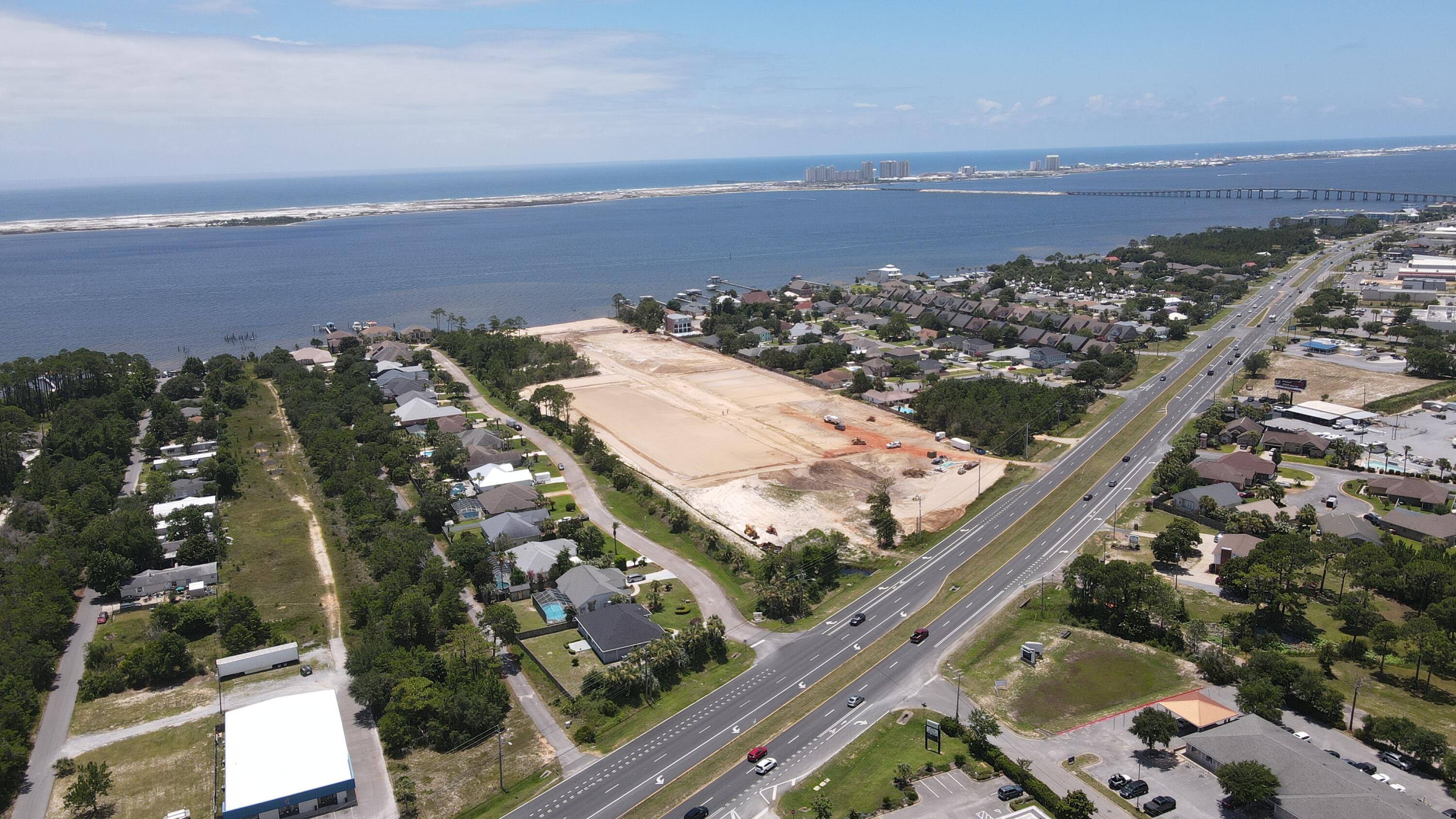 This is one of two commercial parcels fronting Highway 98 in front of the new Heronshaw residential subdivision. Site is marketed as a restaurant site.