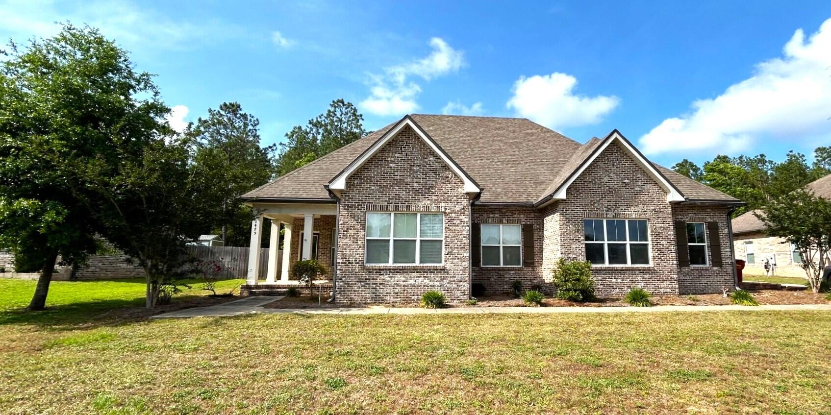 Luxury meets the Country with this 4 Bedroom.2 Bath Home located in Mill Creek Farms. Entrance into the Foyer boast beautiful curved Columns, raised Ceilings, beautiful custom Wood Flooring & Surround Sound. The bright spacious Screened Porch expands your living space perfect for entertaining & relaxing. The kitchen has lots of cabinets, 2 Pantries ,SS Appliances, Granite Countertops & an Island that provides additional counter space for meal preparation & entertaining. The comfortable sized Bedrooms offer plebty of space for relaxation.  Step outside on the screen porch & you will find a fully Fenced Back Yard with 
enough room for outdoor games, entertaining & plenty of Florida Sunshine. Convenient access to Military bases avoiding the high traffic.