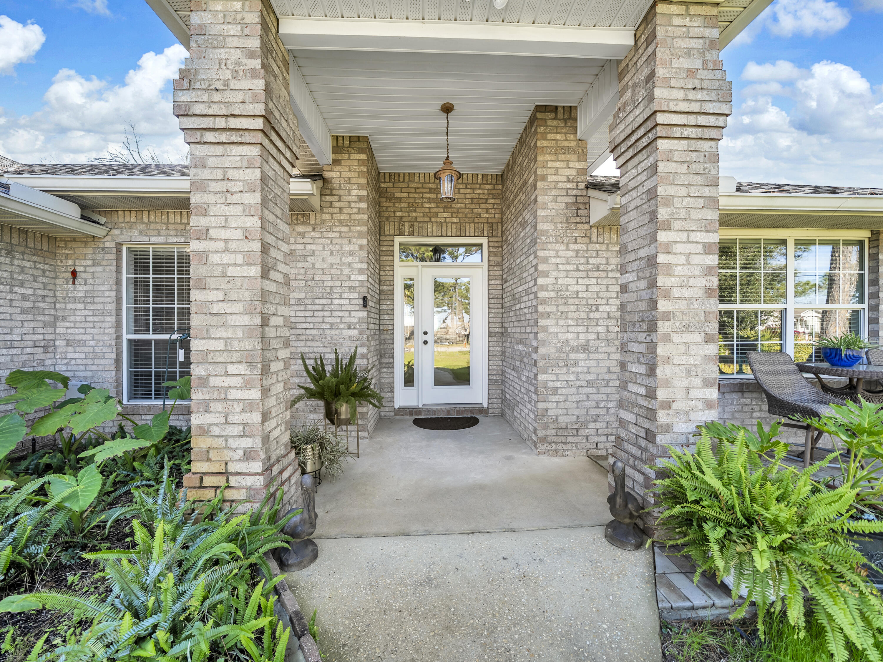 Beautiful solid brick 3-bedroom, 2-bath home located in the highly desirable Holiday Shores neighborhood with NO HOA  fees. This inviting home features a versatile Florida room that can easily serve as a home office or 4th bedroom. Inside, you'll find new flooring, fresh paint throughout, new stove, microwave, and refrigerator. The desirable split floor plan offers added privacy, while the spacious primary suite includes a large bedroom and private bath. Step outside to a level, fenced backyard designed for relaxing and entertaining, complete with a pergola and a generous outdoor seating area perfect for gatherings or enjoying a cozy fireside chat.  Ideally situated just one block from the bay and only 1.5 miles from the stunning blue-green waters and white sand beaches of the Emerald Coast and Gulf.  The roof is 3 years old, new gutter and leaf guard adding peace of mind to this exceptional coastal home.  HVAC regularly serviced, this house has been very well maintained and is waiting for you.  Legion Park is less than two miles away where you can play pickleball, volleyball, basketball or launch your boat or kayak. A great property for Airbnb, VRBO or short/long term rentals.  Great walking neighborhood.   Convenience is key!  You will love how you can jump on a golf cart and go to the beach, bay, parks, restaurants, grocery store and so much more.  House can be sold furnished.  Owner is agent. See agent notes.