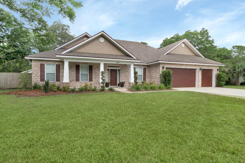 LOCATION, LOCATION, LOCATION! Built in 2016, large lot with beautiful oak trees, 4 BR ground floor, 3.5 BA, large bonus room upstairs, brick home with 3 car garage.  Open floor plan with built-in entertainment center. Master bedroom has his and hers walk-in closets, master bath with his and hers vanities, walk-in shower and garden tub. Kitchen features granite counter tops, stainless steel appliances, beautiful kitchen cabinets and a large walk-in pantry. Kitchen offers eat-in bar with family dining. This home offers a Rinnai tankless water heater and a Carrier Zoned AC system.Three bedrooms have large walk-in closets. Bonus room upstairs with 1/2 bath and storage closet., possible 5th bedroom. Sodded and landscaped yard with sprinkler system.  Covered front entry porch and covered back  lanai patio with gas hook-up for your grill.