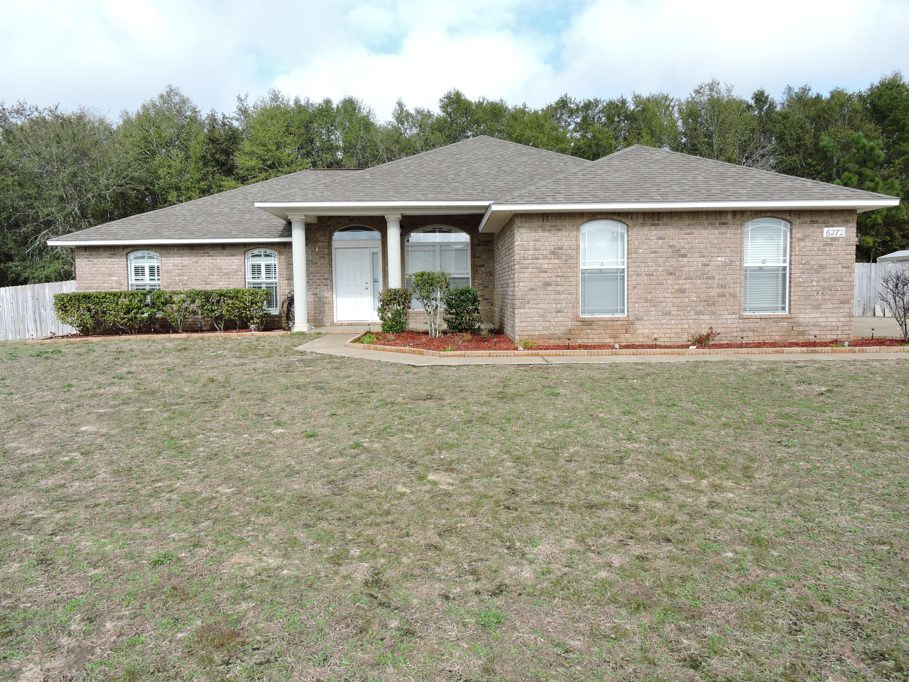 Available Now! - Come check out this beautiful 4 bedroom/2bath all brick home situated on a flat 1/2 acre lot with a privacy fenced backyard. The home welcomes you with large vaulted ceilings in the open concept family room/dining area accented with a fireplace and has new tiled flooring throughout the main living area and wet areas. The home features a split bedroom design with the additional bedrooms being nice sized with ample closet space. The kitchen has plenty of counter and cabinets space, large pantry, granite counters and black and stainless steel appliances. The master suite boasts trayed ceilings, dual vanities, his/her closets, separate garden tub and shower. Schedule your private showing today!