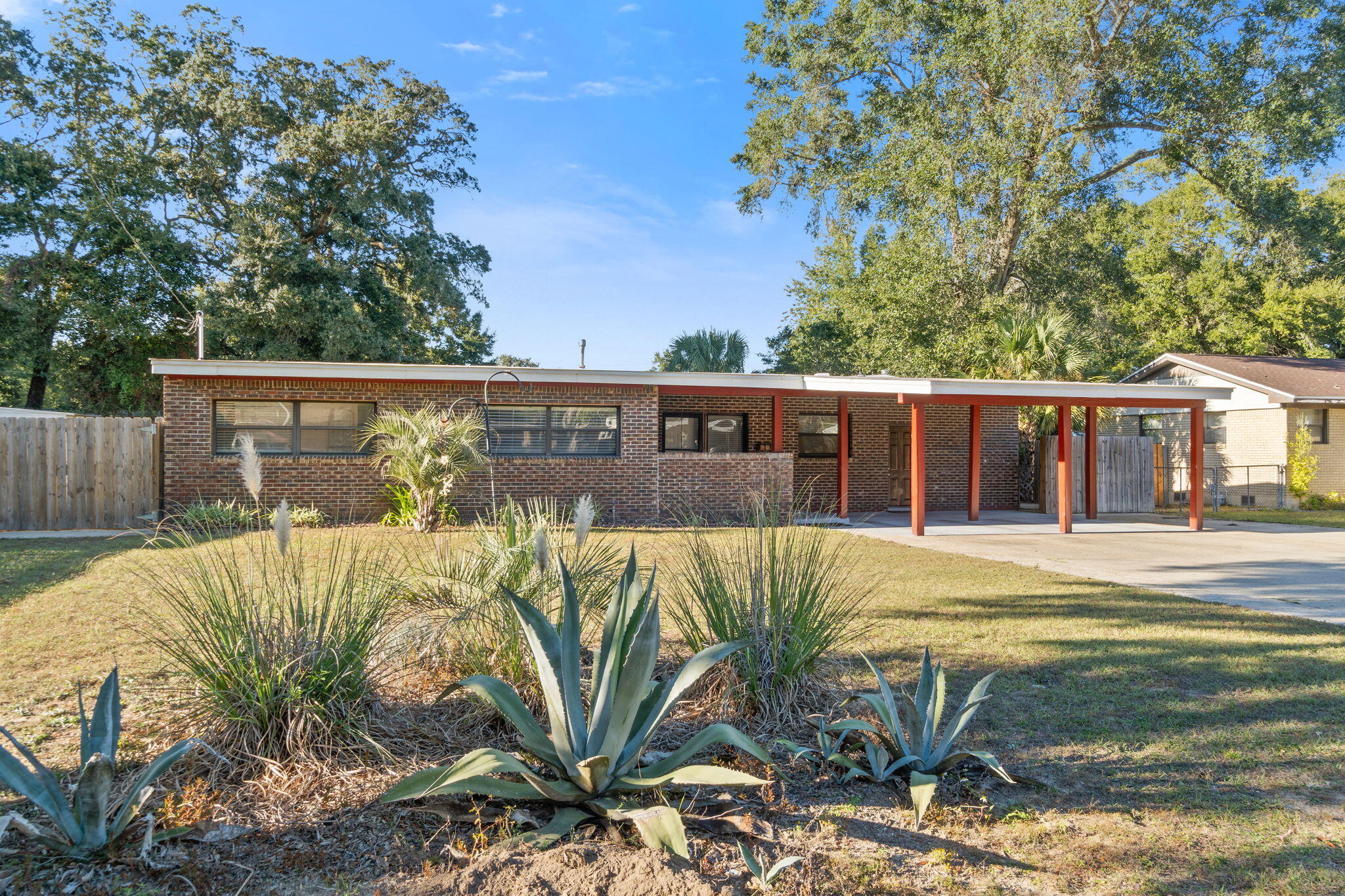 3-bedroom, 2-bath concrete block home features a brick veneer, ceramic glazed tile made in spain, & a sunroom. The roof is just 5 years old, and the electrical system has been upgraded to 200 amp service with a whole house surge protector and generator hookup (generator included). A new HVAC system (approx. 5 years old). 20x18 workshop/garage with 220 wiring. NO  HOA.