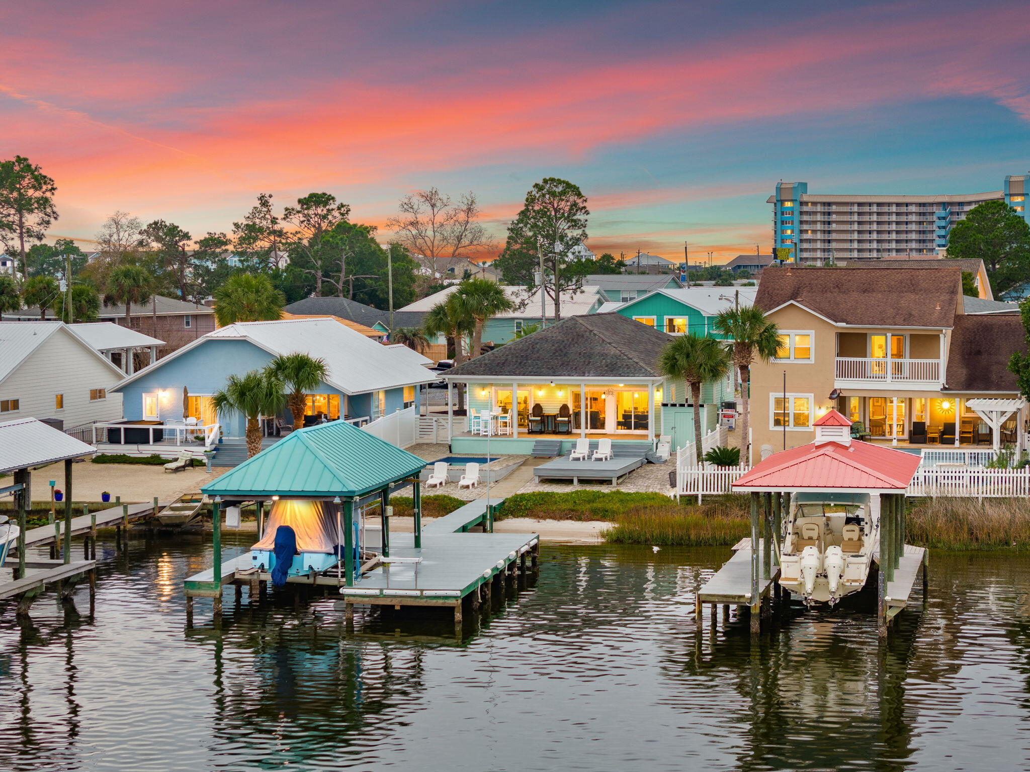 Discover your personal waterfront sanctuary on Grand Lagoon—a rare gem that blends effortless luxury with the serene rhythms of coastal life. 

This beautifully maintained 3-bedroom, 2-bathroom home offers 1,537 square feet of thoughtfully designed living space and panoramic lagoon views that will take your breath away. 

Step outside and discover a private paradise designed for both relaxation and recreation. From the paver-lined drive to the low-maintenance Bahama rock landscaping, every detail speaks to ease of ownership. The Trex decking flows seamlessly to a covered dock outfitted with a boat lift, inviting you to launch into St. Andrew Bay or head straight to the Gulf. A heated and cooled pool ensures year-round enjoymentideal for cooling off on warm afternoons or enjoying a quiet dip under the stars. 

Inside, the open-concept layout is bathed in natural light and oriented toward the water, framing postcard-perfect views at every turn. With furnishings negotiable, this turn-key retreat is ready for immediate enjoyment or prime for short-term rental income. 

Located just moments from the beach and surrounded by three convenient boat launches, it's the ideal home base for boaters, beachgoers, and dreamers alike. 

Whether you're seeking a permanent residence, a vacation hideaway, or a high-performing investment property, this Grand Lagoon gem checks every box. Waterfront opportunities like this are becoming exceedingly raredon't miss your chance to own a slice of paradise. 

Reach out today to schedule your private showing. All information and measurements are deemed reliable however not guaranteed. Buyer should confirm all information.