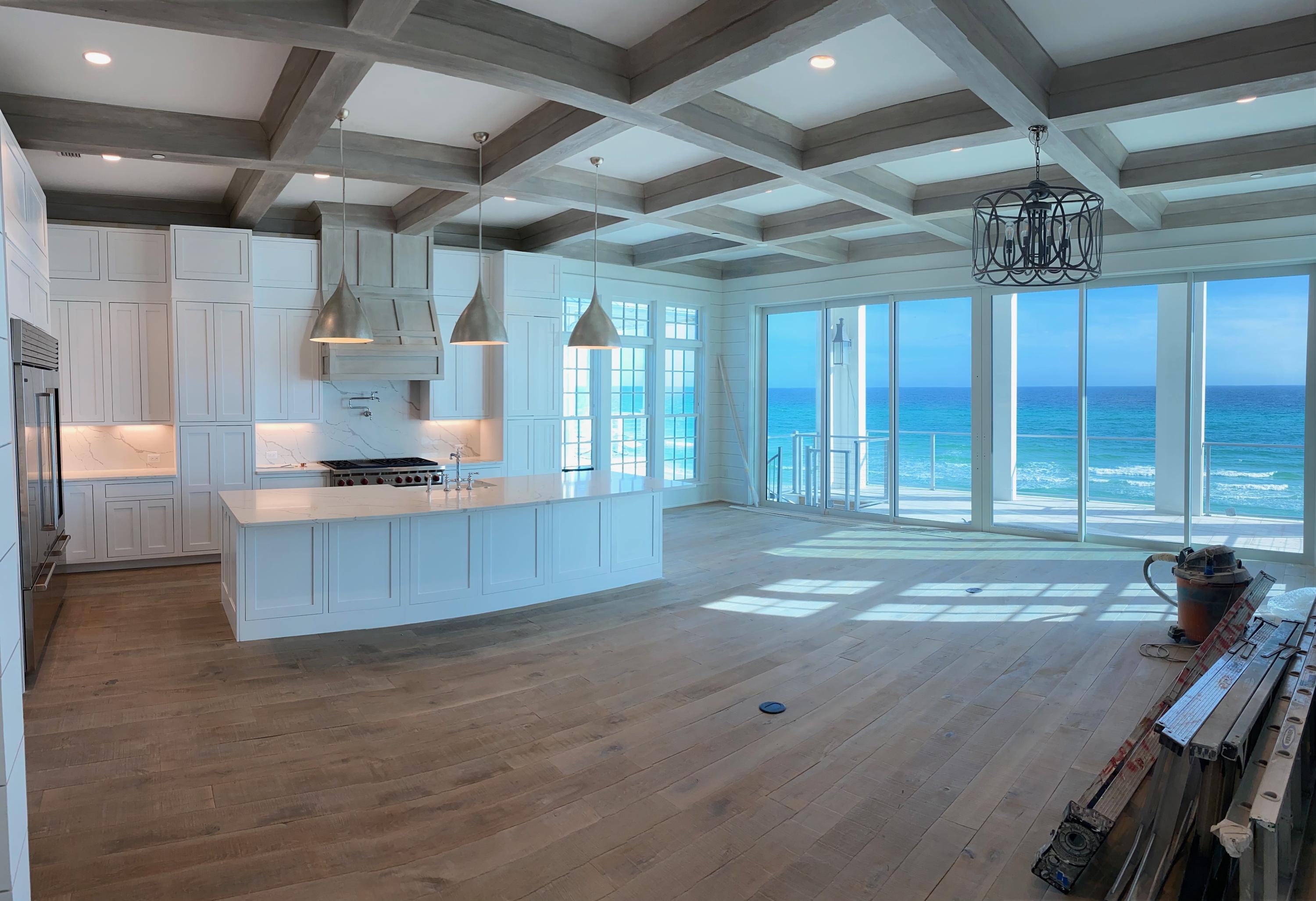 ACCEPTING BACKUP OFFERS. NEW GULF-FRONT CONSTRUCTION wrapping up and ready for Summer 2020! Available for preview now, this custom beach house is the only Gulf-front new construction available between Inlet Beach and Alys Beach. Luxurious single family home located in GATED Water's Edge neighborhood, directly adjacent to Rosemary Beach. Walk to Rosemary, Seacrest, and Alys Beach in minutes. Carefully constructed by Regal Stephens Construction, this concrete home, fortified with steel beams and concrete foundation sits on a high and dry dune 30 ft above sea level and 200 ft back from the mean high water line, safely in the X flood zone. Featuring breathtaking panoramic views from sunrise to sunset, this home is built with a flex plan to serve as either a spectacular personal residence or lucrative rental property.   With only 34 homes in GATED Water's Edge neighborhood sharing 270 linear feet of private beach, this is one of the LOWEST DENSITY beaches on 30A, right in your backyard!  Safe and sound with Weathershield Premium Coastal hurricane impact windows and doors, this Gulf-front retreat is overflowing with custom details and upscale amenities in classic coastal design.  An ELEVATOR services all three floors of this thoughtfully laid out beachfront haven.  Featuring 4 distinct outside entertainment areas including a Gulf-front heated pool, this home is set up for gracious entertaining of large groups and comfortably accommodates extended family!  Over 2000 sq ft of outdoor living space includes a POOLSIDE COURTYARD and OUTDOOR KITCHEN, 2nd floor deck off the main living area and expansive 800 sq ft SUNSET DECK with wet bar on the 3rd floor.  Flexible owner floor plan allows attached, 2-story carriage house with dedicated laundry to be locked off as an owner's section, guest quarters, or to be rented separately.  Two rec rooms with adjoining bunk rooms are perfect for kids and teens.  No feature was overlooked in the generously appointed chef's kitchen, complete with extended custom cabinetry with library ladder, WOLF gas cooking and SUB-ZERO appliances, double refrigerators and dishwashers, 12 ft island for maximum seating and ample storage.  12 ft ceilings and floor to ceiling Windoor glass doors allow expansive Gulf views, maximizing the airy spaciousness of the open concept main living area.  A fireplace and wine bar with DACOR WINE STATION dispenser complete this perfect entertaining space that encourages easy flow from inside to out. Choose between two Gulf-front masters with stunning views, one opening to the pool and one on the private 3rd floor.  Enjoy the beautiful Gulf views from the cast-iron CLAWFOOT TUB or the HIGH PRESSURE HANSGROHE custom shower in the 3rd floor master bath.  Beautiful customization throughout the exterior and interior includes: custom-stained shutters, garage door and gates, copper gas lanterns, peacock pavers used on all exteriors and ground floor, horizontal cable-railing system to maximize views, concrete built-in courtyard seating and landscape planters, wire-brushed and stained solid white oak interior doors, distressed and double-oiled 7-inch wide French oak hardwood flooring, custom stained wood coffered ceiling and range hood, custom cabinetry and closet systems, sandroom with lockers, built-in bunkrooms, marble tile, shiplap walls, reclaimed wood beams and many more tailor-made finishes.  For ultimate convenience, the home is wired for maximum audio/video/internet/security coverage and Control4 system with Sonos speakers throughout.
  
Make 'ONE FIFTY EIGHT' Geoff Wilder Lane your new BEACHFRONT DREAM!