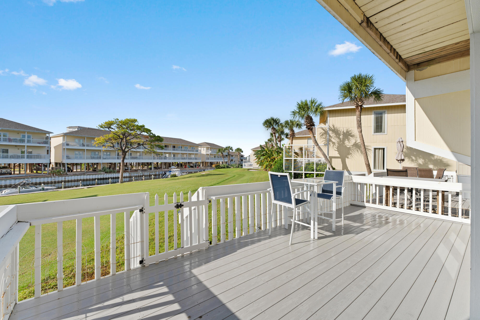 Exquisitely decorated unit on the golf course/canal with a view of the Sunset of the Destin Harbor.  Step into paradise with this stunning, fully renovated 1-bedroom, 1-bath canal-front unit offering 654 sqft of luxurious living space. No detail has been overlooked in this unit featuring fresh paint, crown molding, upgraded ceilings, and stainless-steel appliances. The spa-like bathroom includes a walk-in glass shower, while the unit also boasts a full washer/dryer and ample storage throughout.
Enjoy the peaceful canal views and harbor from the extended back deck, crafted with Wear Deck—fiberglass composite decking that stays cool to the touch. Whether it's breathtaking sunrises or sunsets, this private retreat offers a front-row seat to nature's beauty.