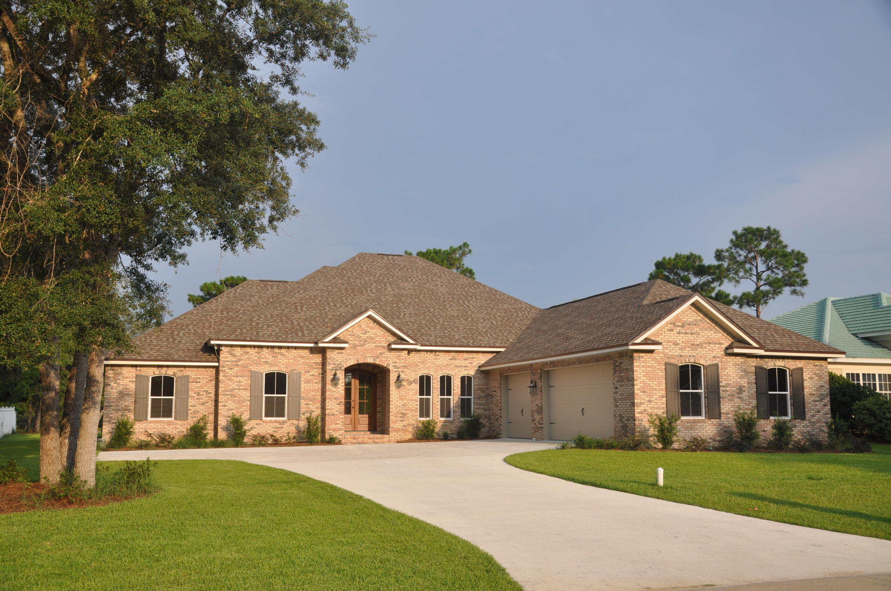 Fabulous Custom Golf Course brick home located on the 18th fairway of the Rocky Bayou Country Club. This home has 4 bedrooms, 3 full baths, Large great room with a gas log fireplace, formal dining room, breakfast room, and A Media/TV room. There is a large gourmet Kitchen with a 6 ft island, custom Cherry cabinets, Stainless Steel appliances, and beautiful granite counter tops. The large master suite (18x17) has a trey ceiling and the master bath has two large walk in closets, whirlpool tub, separate tile shower, and tankless Rinnai Hot water. There is a 28x13 covered porch overlooking the golf course. All ceilings elevated. Hurricane rated windows. The over sized garage(35x24) has space for golf cart, or a large workshop. There is an incredible view of the golf course from this new home.