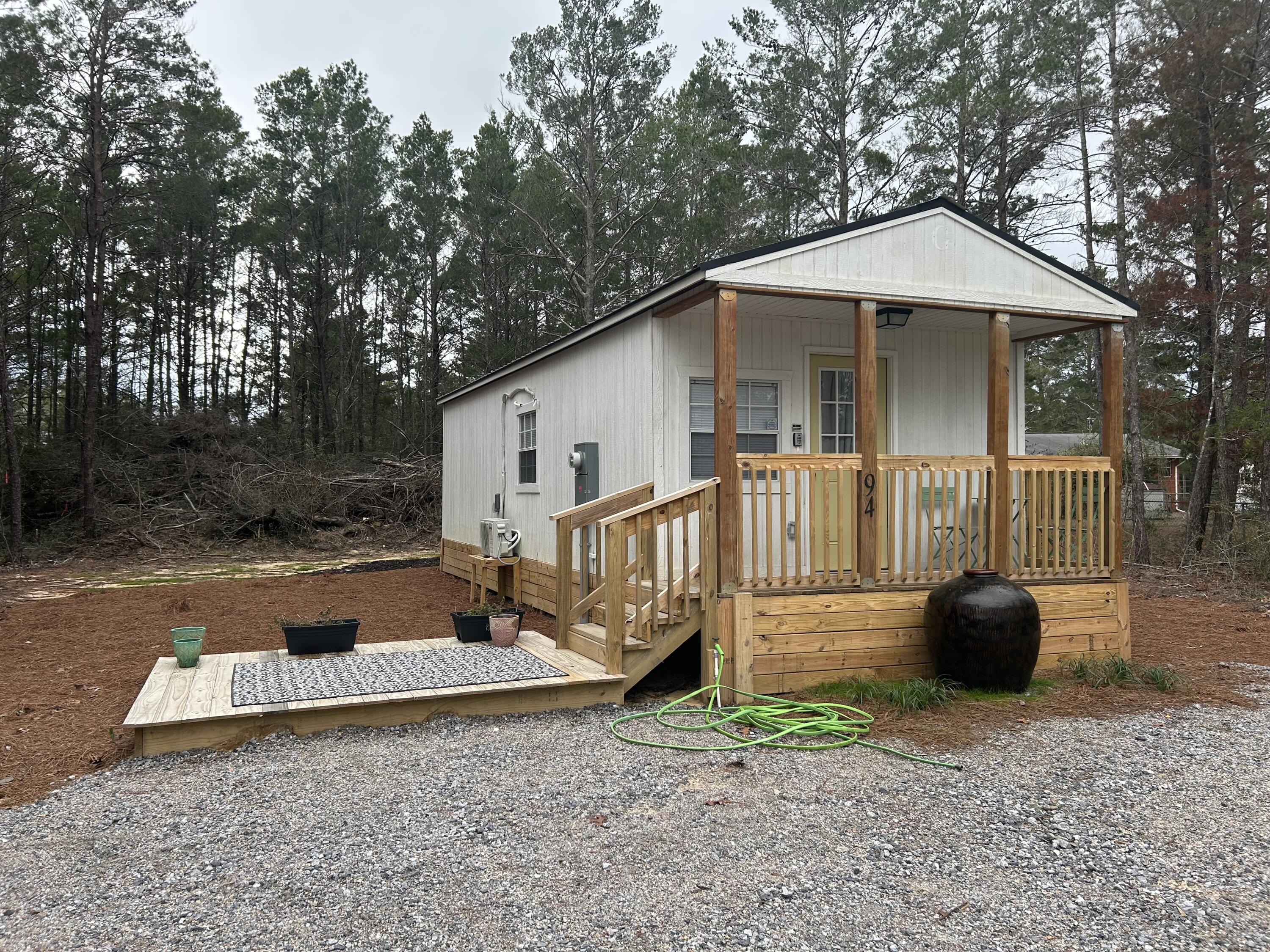 Back on the Market—No Fault of the Seller | OWNER FINANCING AVAILABLE!
This fully furnished tiny home is the perfect blend of comfort, style, and smart design. Inside, you'll find a cozy living space with room for a fold-out sofa bed—great for hosting guests. The updated kitchen features full-size appliances, butcher block countertops, new cabinets, and a stainless steel sink.

An energy-efficient ductless A/C and heating system keeps the space comfortable year-round. Whether you're looking for a personal getaway, a low-maintenance home, or a great investment opportunity, this property is ready to perform—don't miss out! Schedule your showing today!