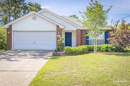 Welcome home to this East Navarre beauty! This spacious 4 bedroom/2 bath home is situated on a large oversized lot measuring at 0.67 acres! This home has an open floor plan with over 2,400 square feet of living space with tile throughout other than the bedrooms. You will walk through front door to the appropriately sized kitchen featuring a center island, pantry, stainless appliances, and natural sunlight provided by the many windows. The master bedroom leads to the master bath that features double vanities, a separate stand up shower, soaking tub, and walk in shower. The other three bedrooms are perfectly sized and you'll enjoy the spacious laundry room. Water heater replaced Feb 2020. Enjoy a short commute to Hurlburt Field, being walking distance to the YMCA, Navarre Youth Sports Association facilities (playgrounds, baseball fields, walking trails), basketball courts, and dog parks, not to mention just miles from the beautiful white sand and emerald waters of Navarre Beach! Be sure to set an appointment soon as this house will not last long!