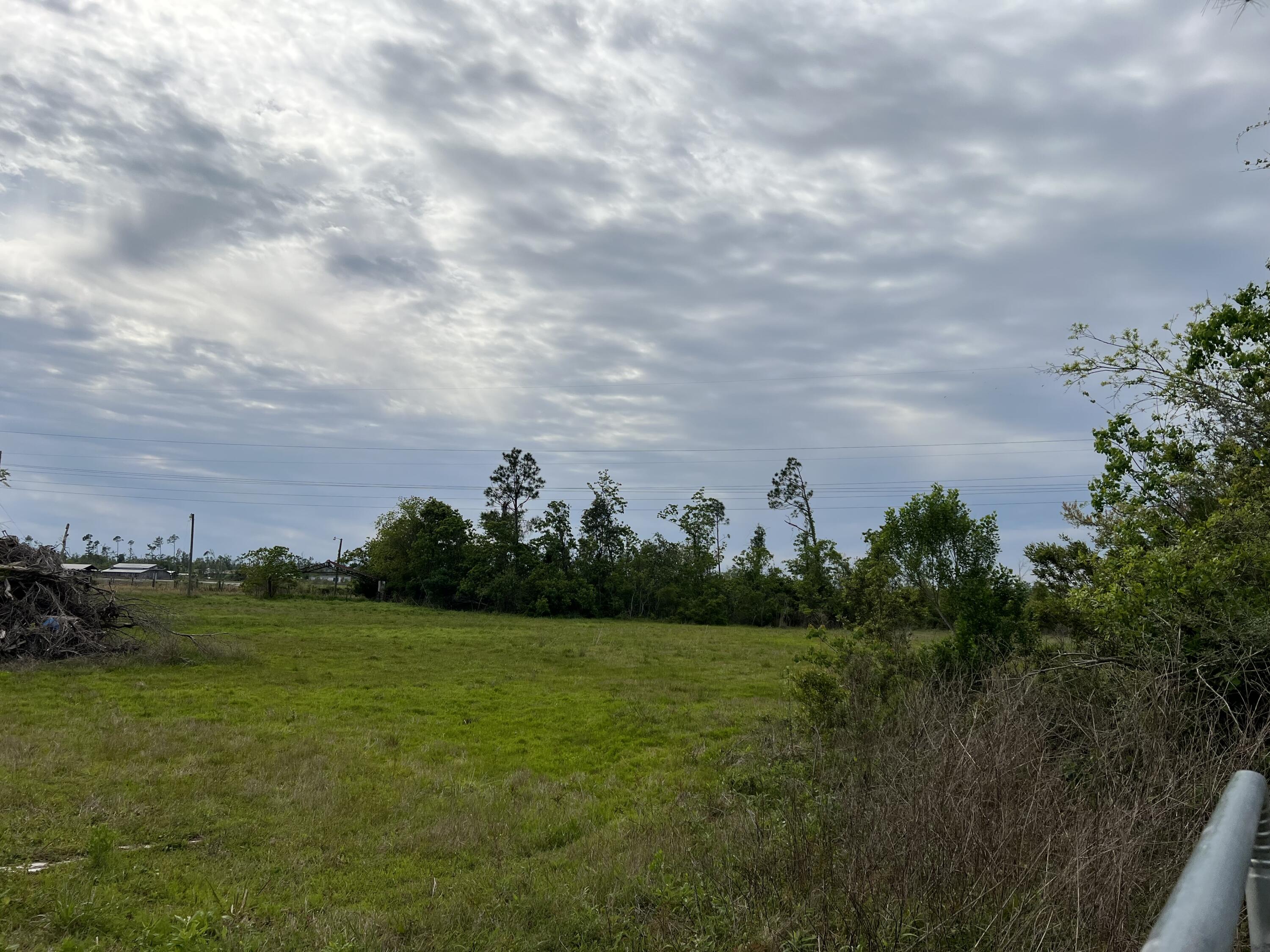 BEAUTIFUL GREEN ACRES IN PANAMA CITY!   Cleared piece of property.  No HOA or restrictions on this property according to the seller. Zoning: R-2 Duplex/Manufactured Home.  Just a little over 25 miles to white sandy beaches along the gulf coast as well as pier park in Panama City Beach where there is shopping, restaurants, and fun activities for the whole family.  17 miles to Tyndall Air Force base and 10 miles to town in Panama City.   The owner used the property for their horses.   It previously had a barn a on the property that has been taken down.  Additional piece of land available (MLS 920312 - ECAR).  No utilities on the property.