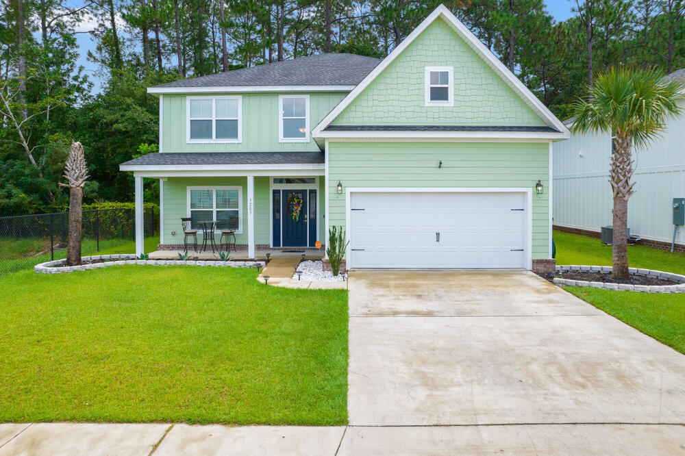 Welcome home to this stunning and spacious custom craftsman style smart home located in the popular neighborhood of Heritage Oaks. Conveniently located less than 30 minutes to Hurlburt Field and only minutes to Navarre's beautiful beaches, you don't want to miss this one! If you're looking for space you're going to love this 4 bedroom (plus a flex room!), 3 bath home featuring 2460sqft in a beautiful two story layout. Pull up the front driveway and appreciate the tasteful and well maintained landscaping, and walk up to the front door where you'll take in the nice sized covered front porch. Enter inside and to the left you'll find a flex room perfect for a playroom or office! Keep walking down the luxury vinyl plank adorned hallway and you'll come to a lovely dining room space that's open  to the gorgeous and well appointed kitchen featuring granite counters, white cabinetry, and stainless appliances with a center island. From there you'll absolutely love the living room with the soaring two story cathedral ceiling with plenty of natural lighting due to the two sets of windows. The hard surface flooring extends through the downstairs common areas and you'll find blinds on all the windows. Also downstairs is a bedroom with a nice sized closet and a full bathroom. Walk up the wood planked stairs and you'll find the other three bedrooms, as well as the laundry room for convenience. The two upstairs bedrooms feature walk in closets and share a spacious bathroom with double vanities! The master bedroom retreat is an absolutely dream and is upgraded with tile throughout, and even has a sitting area (currently being used as a nursery). There is plenty of room for all your furniture, or this furniture as most of the seller's furniture is available for sale! You'll love the massive walk in closet, and the en suite bathroom is a dream with a stunning walk in tiled shower, separate soaking tub, private water closet, and double granite vanities. In the backyard you'll find a quiet retreat where you won't be looking at any neighbors! With a natural buffer the lawn maintenance is minimal, and the gorgeous pavers will convey for free (wow!) along with the plans the Seller had drawn up to extend the back patio and add a firepit. Cameras and smart home system will also convey. Don't delay on this beautiful home in a fantastic neighborhood!