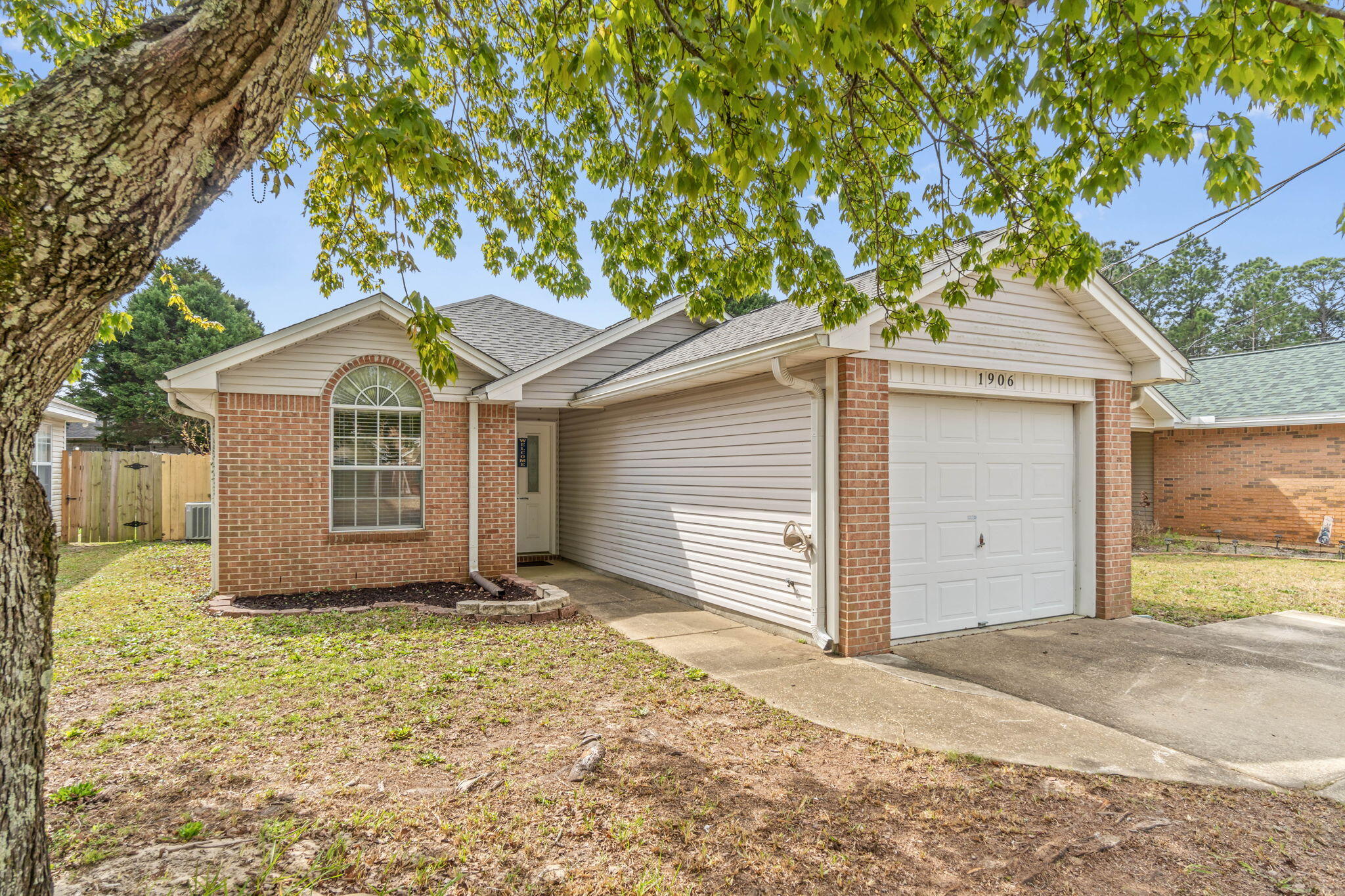 *New Roof, Feb 2024! Adorable and move in ready just minutes from Hurlburt's back gate! Enjoy an open floor plan with soaring vaulted ceilings, with updated laminate flooring in the common areas, tile in the wet areas, and newer carpet in all three bedrooms. The living room features vaulted ceilings making the space feel much larger, with a wood burning fireplace, which is open to the kitchen featuring stainless appliances. The adorable master bedroom also features a vaulted ceiling along with a large walk in closet, in fact all the bedroom closets are nice sized! Enjoy the screened in porch for cookouts and entertaining, and you'll love this location on a quiet dead end street with a cul-de-sac. Water heater was replaced in 2020, and HVAC was installed 2013. Washer and dryer will convey.