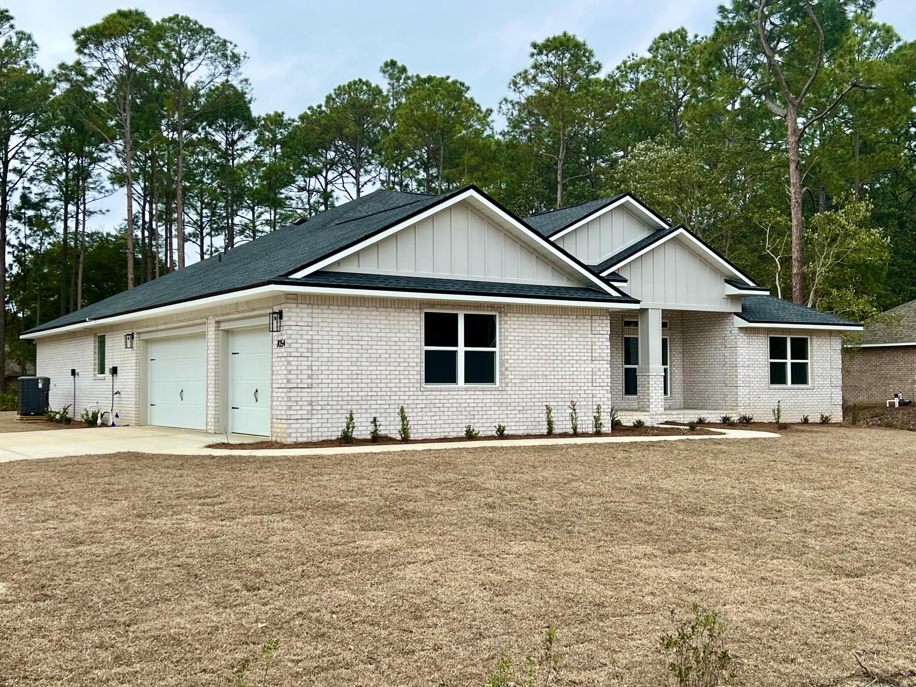 NEW Custom Built Home in Holley By The Sea,Enjoying all the Club House amenities including :Pools,Fully Equipped Gym,Tennis Courts,Waterfront Park & Deeded Access to Santa Rosa Sound .This luxurious 4 bed/3 bath Tri split floor plan is estimated to be complete late Oct 25 ~Desirable Corner Location within HBTS..with easy access to Navarre Beach, shopping and Hwy 98 to Hurlburt Field AFB.This Stunning Robbins Builders Custom Home~offers trend setting design & features~Greeted by a walk in foyer open to the Formal Dining and Office with double glass doors/sweeping through to your open floor plan ~Large Gourmet kitchen enjoying shaker cabinets with crown molding beautiful Quartz counter tops~Tiled Back splash~ Under mount sink~S/S appliances~large walk in pantry ~center island with open flow to the breakfast nook and family room, wood plank staggered tile through the foyer, dining room, main living area, laundry and bathrooms. Large Master with trey ceiling & ceiling fan. Master bath offers a large tiled walk in shower /separate soaking tub~ double vanity with picture frame mirrors & huge walk in closet.Two additional bedrooms are a great size with ~ ceiling fans and Jack & Jill bathroom ~ step in tub/shower & WC with separate closet /vanity areas.Third additional bedroom is separate from the other rooms and would make a perfect guest/teen suite with its own bathroom and access out to the large covered porch.Laundry room & over sized 3 car garage ...ideal for the larger trucks and still plenty of room for all the outdoor toys. Home is situated on a large lot with grassed yard ~sprinkler system~ lawn pump and well with digital programmable timer for easy care. TAEXX in wall pest control system~ Fabric Shield Hurricane protection and dimensional shingle roof for lower insurance premium. Upgrades include crown molding, recessed lighting ,framed mirrors, deluxe lighting package,50 Gallon water heater, garage door remotes, attic drop down stairs~ to name a few......Call today for further information ,colors and construction status.** pictures are of a previously closed home so colors ,fixtures & finishes may vary .