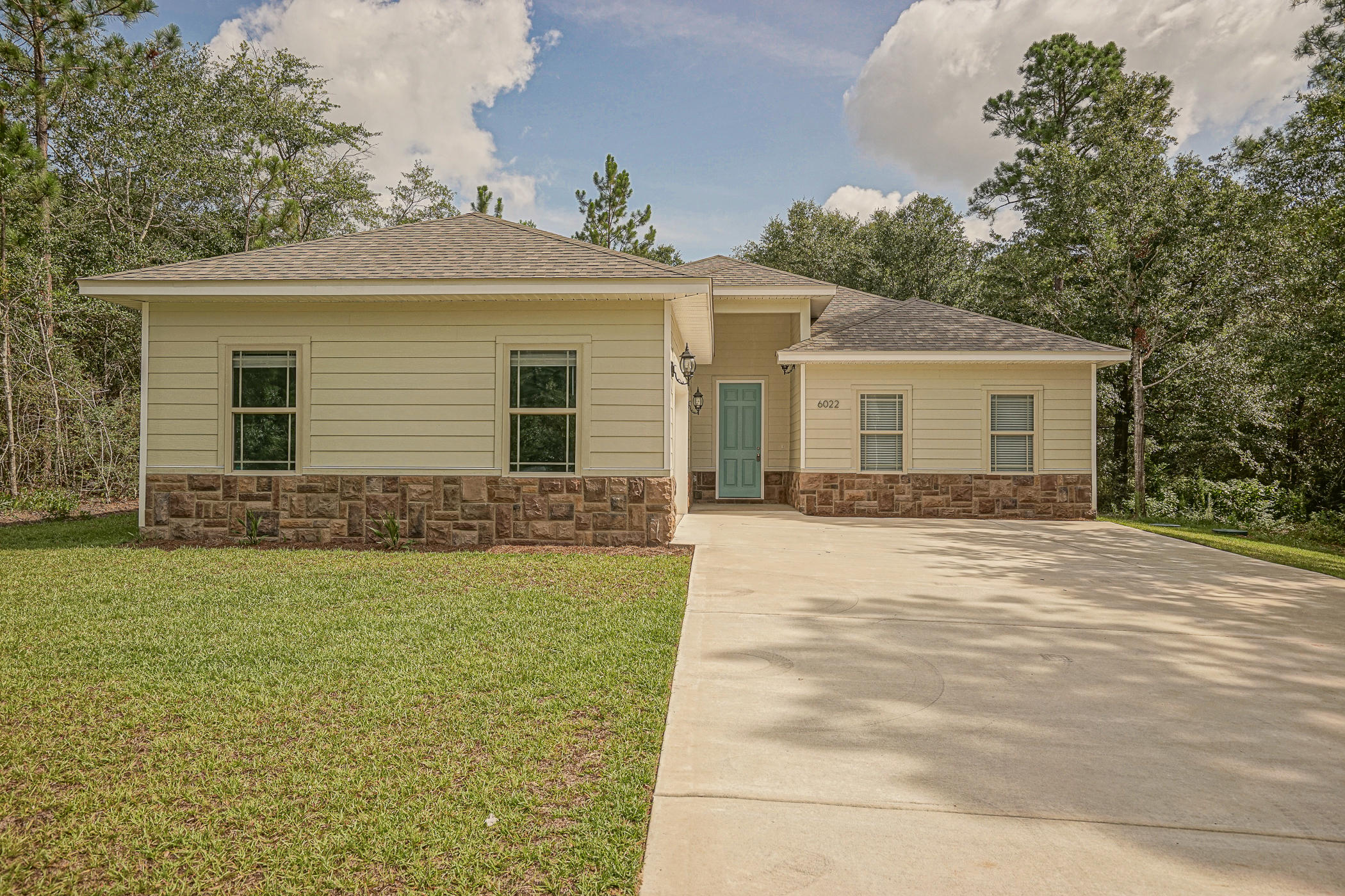 REO. Beautiful home in the quiet and peaceful subdivision of Camellia Cove. This home was completed just this year, and is move-in ready! The lot is 1/2 acre with large areas of land on both sides of the house! The home features cathedral ceilings, large bedrooms, and a large kitchen and dining room!