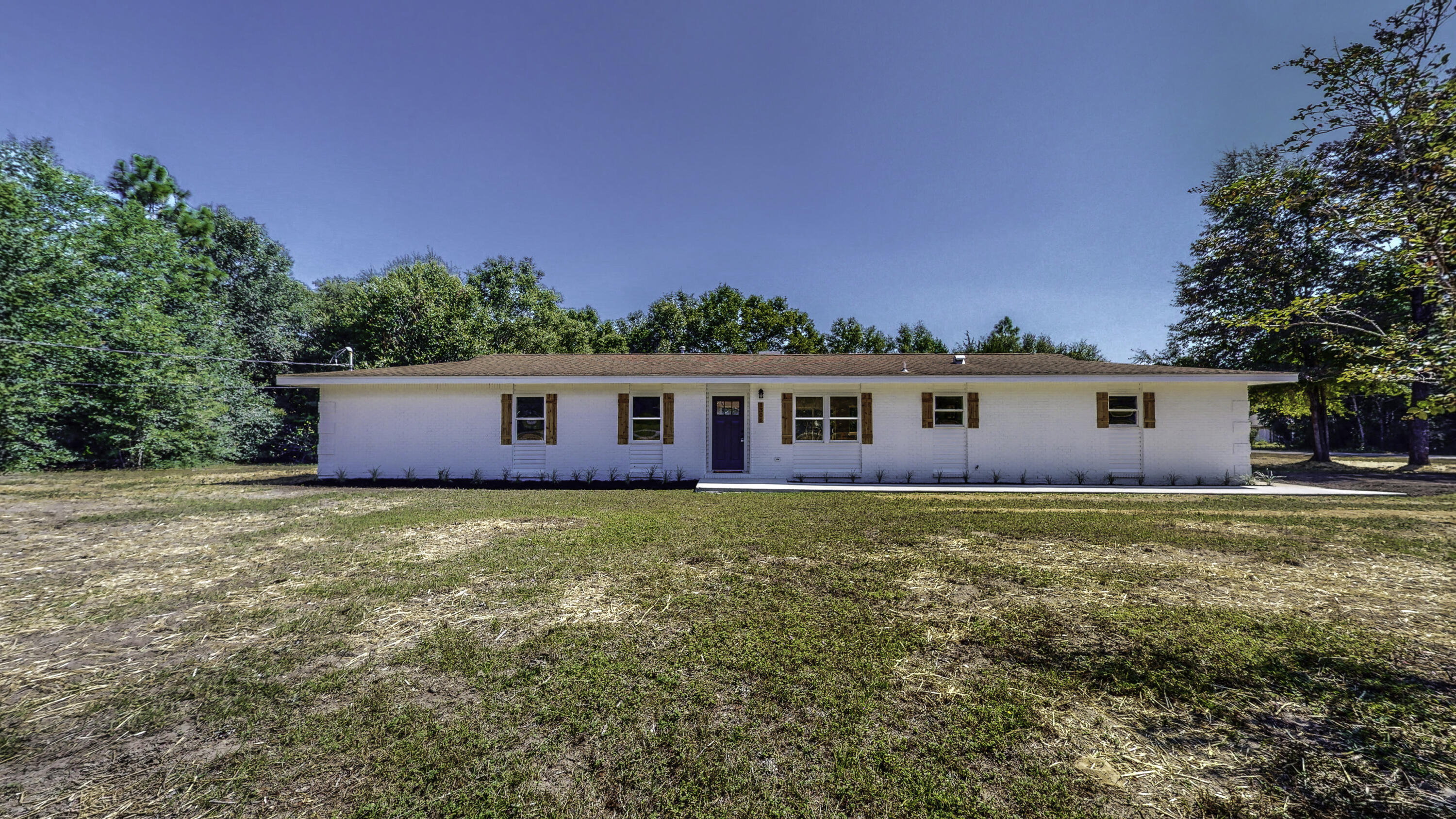 Newly renovated 3 bed 2 bath home on a large 1 ACRE CORNER LOT in Grandview area of Crestview! Open floor plan with a custom renovated kitchen, totally updated with beautiful new shaker style cabinets, white/gray granite counter tops, white tile back splash, stainless appliances and large island.  Custom ship lap walls/trim in several areas including fireplace.  New vinyl plank ''wood look'' flooring in living areas/baths, newly carpeted bedrooms and baths have been remodeled/updated with new vanities, hardware, white marble counter tops and refinished/new tub/showers. New vinyl clad windows and doors as well.  plenty of room to add a pool, workshop or RV Parking!