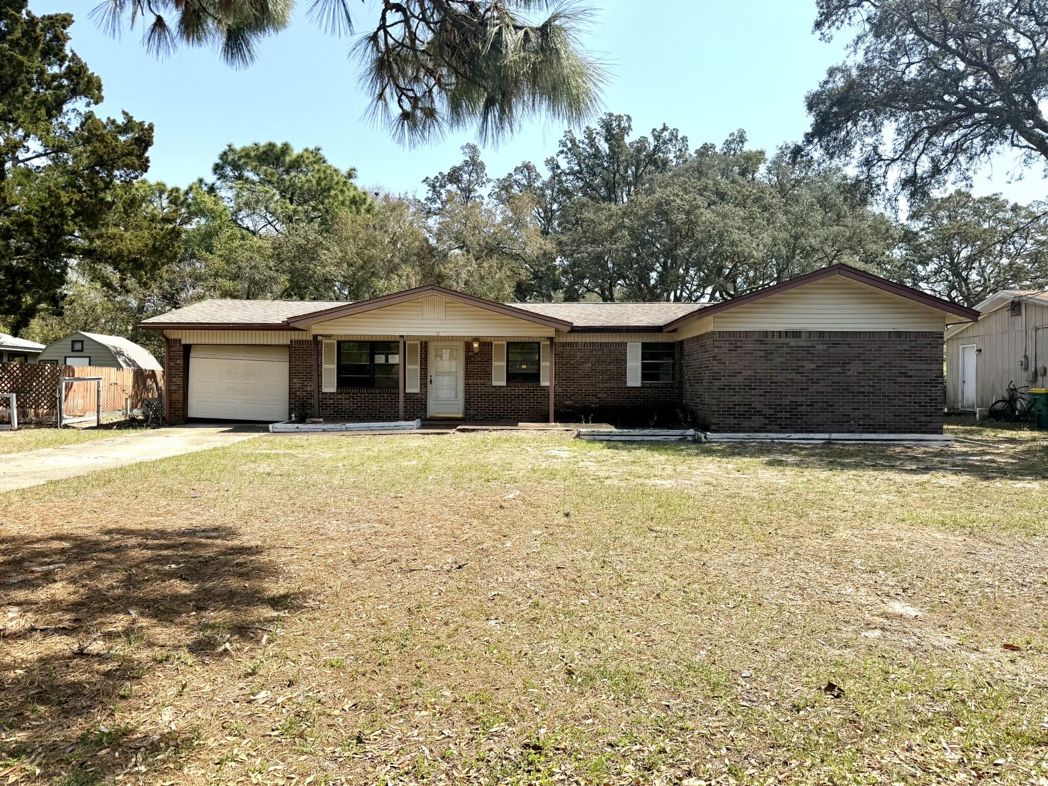 REO - Opportunity in the heart of Shalimar! This 4BR/2.5BA home sits on a .18-acre lot on Berwick Circle and offers great potential for the right buyer. Property features a 25-ft in-ground pool (not currently operable), mature landscaping, and a spacious backyard. Sliding glass doors from the primary bedroom lead directly to the pool area, creating a great indoor-outdoor layout once restored. Home includes a one-car attached garage, generous driveway parking, and a functional floor plan with multiple large bedrooms. Conveniently located just minutes from Eglin AFB, Meigs Park, schools, shopping, and dining. Property is being sold as-is, but offers a strong opportunity to renovate and add value.