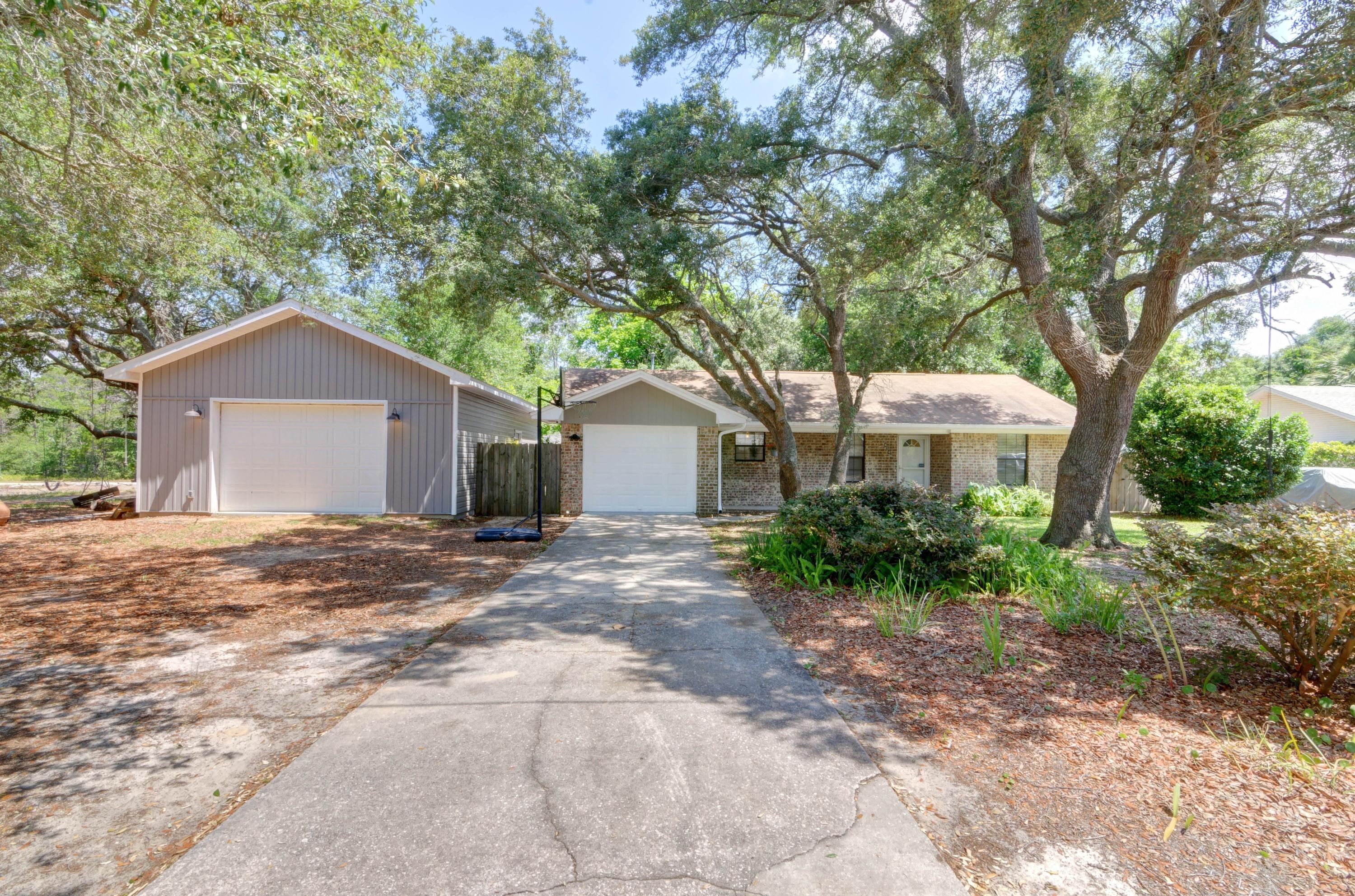 *New roof with architectural shingles being installed prior to closing!* Welcome home to this unique gem! Featuring 3 bedrooms, 2 baths plus a 20x20 Florida room, a heated and cooled garage, AND a massive 22x34 (748sqft) custom made workshop with 10' ceilings just built in 2019 this is one you don't want to miss! You'll love the updates like a new HVAC in 2013 and upgraded house power to 200 amps as well as the upgrade to underground utilities. The workshop features 60 amp service with 220VAC outlets on each wall, as well as 110V & 220V outlets in center of the slab. The Lifemaster garage door opener has a battery backup and MyQ Wifi remote operation as well as an insulated garage door with a PTAC AC and heater. Inside you'll find an adorable home with a renovated kitchen featuring updated kitchen appliances where you'll enjoy cooking on a gas range with a butcher block island and tasteful subway backsplash. There is no carpet has hard surface floors extend throughout all three bedrooms with tile floors throughout the sprawling Florida room (complete with an AC unit and pellet stove) overlooking the large backyard. Outside you'll find an additional covered patio, as well as two more yard buildings. Don't delay on this unique and one of a kind property!