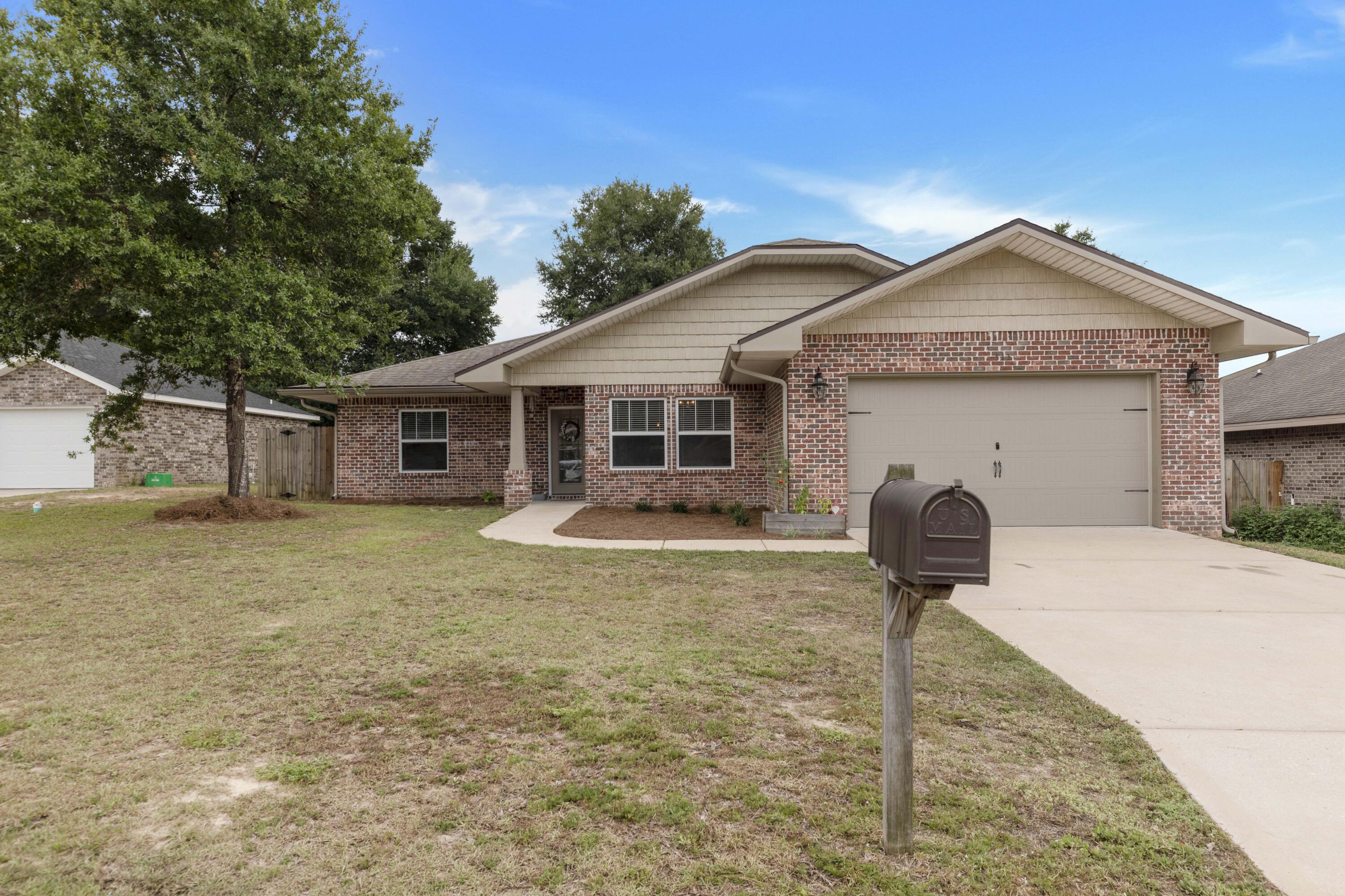 $5,000 towards Buyer's Closing Costs! Beautiful 4 bedroom 2 bathroom all brick home built in 2017! Custom floor plan by multiple award winning builder and 2017 Parade of Homes winner! This home offers 10 ft. ceilings w/ impressive crown molding, 12x24 offset tile flooring, and 5 1/4'' baseboard throughout the main living areas. On the exterior of the home, this Craftsman style home has a covered porch w/ columns  and 8 ft leaded glass door. The privacy fenced backyard has shade trees and a generous covered open porch perfect for entertaining. The exterior also has an irrigation system, rain gutters and  a two car front entry garage and driveway. As you enter the home you are greeted by a long foyer escorting you to the living room. The large living room boasts tile flooring, crown molding ceiling fan, and recessed lighting. The living rooms open concept blends into the kitchen separated by the long breakfast bar counter top and bar stools. The kitchen is a chef's delight kitchen which boasts maple cabinetry, granite countertops, a huge pantry, and stainless appliances (including an oversized commercial grade refrigerator/freezer, dishwasher, microwave, smooth top range). Between the kitchen and the dining room you will find a wet bar and wine refrigerator. The spacious formal dining is adorned with crown molding and connects to both the kitchen and the main foyer. The master bedroom is privately located on the right side of the home and has crown molding, ceiling fan, and two windows for plenty of natural light. The master bathroom and his/her closet are equally as large as the master bedroom. The master bathroom had a jacuzzi tub, separate walk-in tile shower, double vanity, water closet, his and her closets and linen closet. On the other side of the home, you will find 3 additional large bedrooms with spacious closets. Two of the bedrooms share a Jack and Jill bathroom that can also be shared with guests. The indoor laundry room also offers plenty of space and connects to the 22' deep x 20' wide garage, complete with pull down stairs and auto opener. Don't miss out on your opportunity to see this beautiful custom touches you just don't see every day. Schedule your showing today!