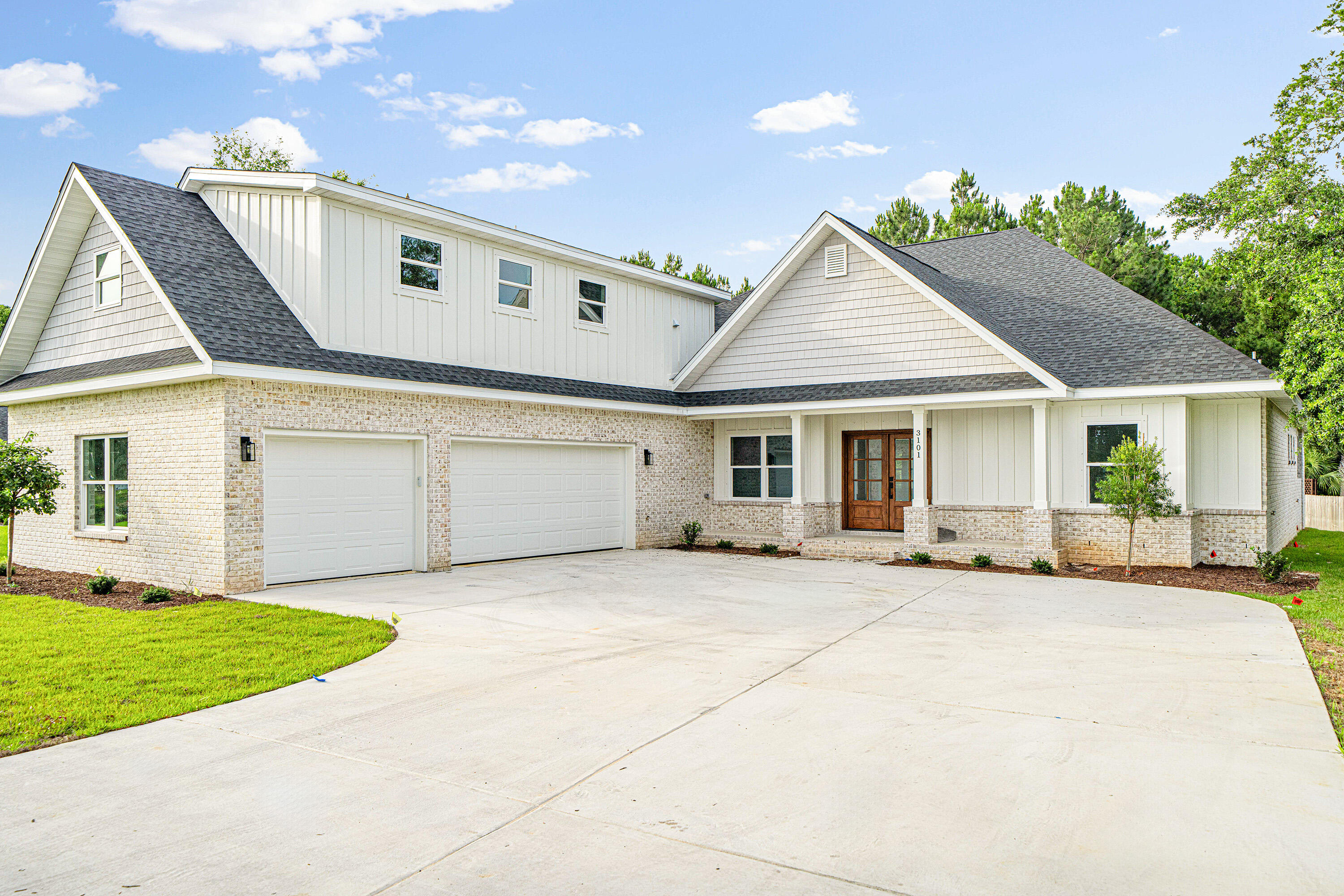 Luxury new construction in the sought-after Hidden Creek golf course community in Holley by the Sea. This beautifully designed 4-bedroom, 4-bathroom home features a dedicated office, an expansive upstairs bonus room, huge 3-car garage, covered porch with fireplace and outdoor kitchen area, and large backyard with room for a pool. Holley by the Sea is known for its 48-acre recreation center, which includes clay tennis courts, pools, fitness center, sports fields, and more. This home has golf course views and is steps away from Hidden Creek Country Club. Just 15 minutes from the pristine shores of Navarre Beach and a short commute away from Hurlburt Field Air Force Base, this home offers the perfect blend of resort-style living and every day convenience. Step through elegant double front doors into a welcoming foyer that sets the tone for the home's upscale finishes and thoughtful design. The spacious living room showcases a striking wood coffered ceiling, adding warmth and architectural detail to the heart of the home. Designed for both entertaining and relaxation, this area flows seamlessly into the kitchen, which is a chef's dream. It features built-in stainless-steel appliances, a large island with quartz countertops, farmhouse sink, and ample cabinetry for storage. 

The master suite is located on its own side of the home and offers a peaceful retreat, complete with a tray ceiling, large his-and-hers walk-in closets, and a sliding glass door that provides access to the back porch. The luxurious en suite features a freestanding soaking tub, large tiled walk-in shower, and dual vanities. 

LVP flooring runs throughout the common areas, office, bathrooms, and master bedroom, providing a durable and low-maintenance finish--with plush carpeting in the guest bedrooms and upstairs bonus room.

Just off the dining area, you'll find Bedroom 2, which is conveniently located near the back exit--perfect for guests or multigenerational living. It has easy access to a full guest bathroom featuring a walk-in shower and quartz countertops. There are two additional guest bedrooms located near the dedicated laundry room, which share access to a third full bath.

From the laundry area, a beautiful staircase leads to the massive upstairs bonus room, which offers stunning golf course views and includes an en suite bath. This versatile space can easily serve as a 5th bedroom, guest suite, media room, or playroom. There is an additional closet just outside of the bonus room for extra storage.

Enjoy outdoor living year-round on the covered back porch, which includes an electric fireplace, beverage refrigerator, TV/media hookup, and space for a built-in grill. The large backyard has plenty of room for a pool or outdoor activities. Additional highlights include a 3-car garage with 60-amp car charger, a Rinnai tankless hot water heater, recessed lighting throughout, full irrigation system, and a backup generator-ready panel with plug and automatic transfer switch. 

Holley by the Sea is a vibrant community with 8 clay tennis courts, lap pool, family pool, baby pool, event hall, fitness center with weights and cardio, volleyball court, basketball court, sports field, RV and tent campground, and youth department with before and after school care and summer camp. There is truly something for everyone.

Don't miss your chance to make this home yours. Schedule a private showing today! Buyer to verify all pertinent information in listing, including dimensions.