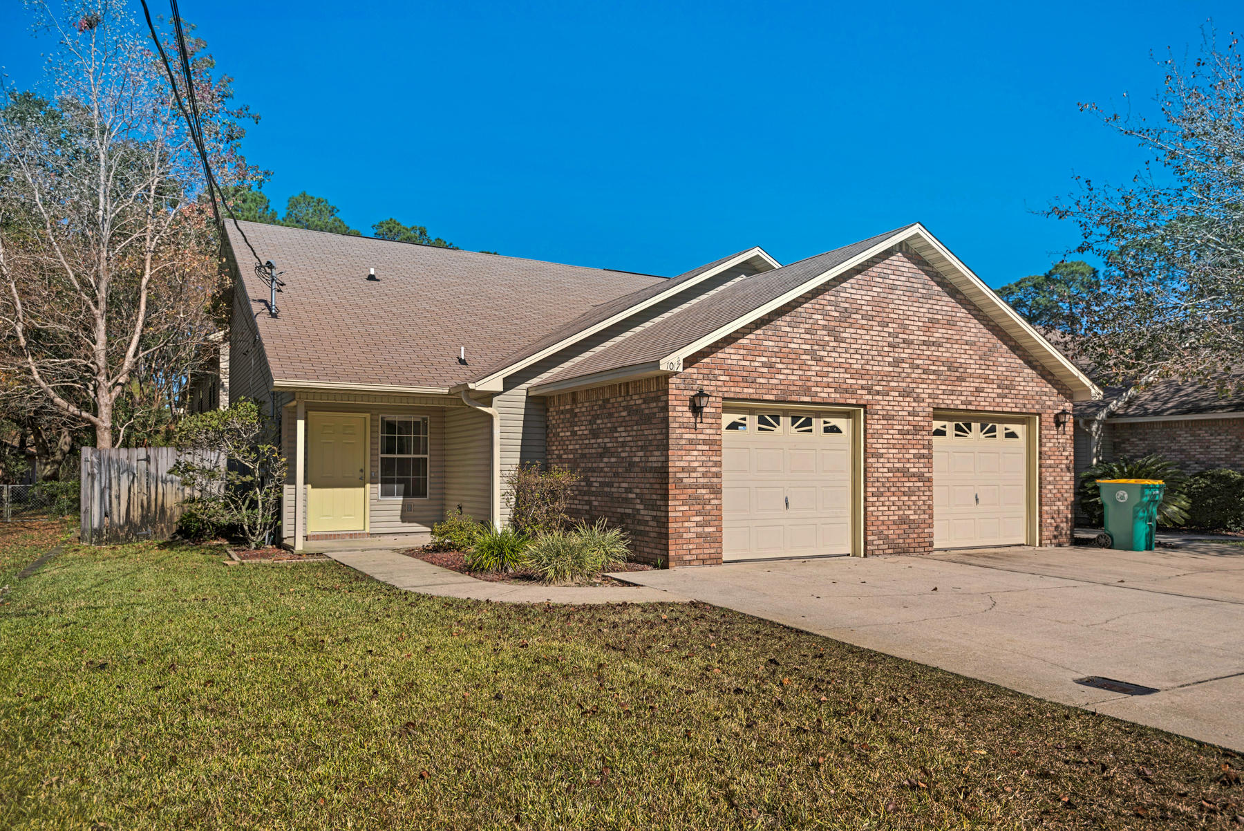 Lets Look!...the welcome mat is out! Imagine your Christmas Tree in this oversized living area. This end unit is located in a quiet, charming well established neighborhood. The open floor plan, downstairs master bedroom and upstairs with additional 2 bedrooms is perfect for a new home owner looking for their piece of the Emerald Coast. The kitchen makes every square inch count. Clean and uncluttered as well as cosy and efficient. New Hot Water Heater installed 11/17 to help ease any concerns for the hot showers! A concrete-paved courtyard patio makes an open air room, reminiscent of a Mediterranean climate. Great property also for the investor looking for a great location and endless possibilities. All new hard flooring and paint enable this property to be turn-key to profit for anyone.