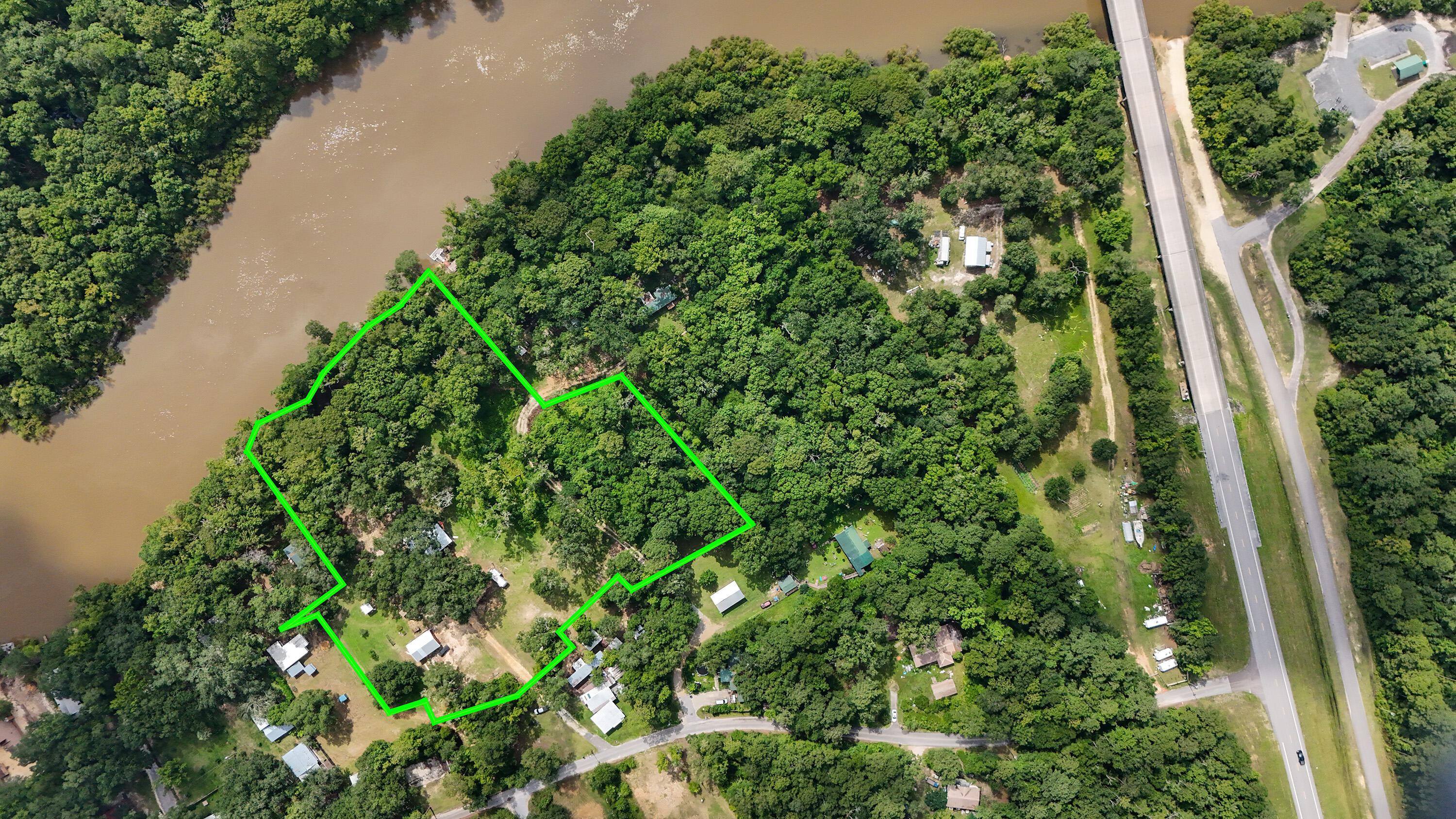 Discover your serene oasis at 70 River Loop Road, Bruce, FL 32455. Nestled on 3.13 acres of pristine land, this stunning property is situated right on the majestic Choctawhatchee River. Offering unparalleled privacy, this spacious 3-bedroom, 2-bathroom home boasts approximately 2,120 square feet of living space, enhanced by the newly enclosed front sunroom.

Perfect for outdoor enthusiasts, this home is a haven for fishing and boating activities. Imagine waking up to the tranquil sounds of nature and enjoying your morning coffee while overlooking the river. The property features a brand-new metal roof installed in the past year, ensuring peace of mind and longevity. This home is a work in progress and offers a fantastic opportunity for those looking to add their personal touch through renovations. Embrace the potential to customize this property to suit your vision and create your dream riverfront escape. Don't miss out on making this tranquil haven your own!

Whether you are seeking a peaceful retreat or a place to entertain family and friends, this unique property offers endless opportunities. Don't miss the chance to own your slice of paradise and embrace the outdoor lifestyle you've always dreamed of. Come experience the natural beauty and charm of this exceptional home today!