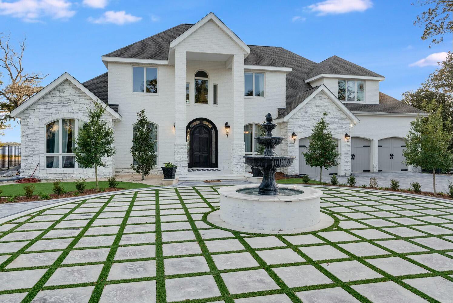 Perfectly positioned on one of the most sought-after WATERFRONT streets in Panama City, Florida - this stunning .8-acre estate sits on 100' Bayfront water frontage and features a luxurious modern coastal design. This home features a zero-entry infinity edge pool, dock with boat lift and is less than 6 nautical miles by boat to the open Gulf of Mexico with no idle speed zones in between. 

From the minute you drive into this gorgeous estate, you're drawn in by remarkable landscaping with mature trees, a beautiful circular driveway and thoughtfully-designed pavers surrounding a care-free turf base. The exterior has been recently renovated and features a brick and stone design with a 2.5 car garage. This 2-story home has impeccable WATERFRONT views from almost every room and features 4 bedrooms, a home office, movie theater room, 3 full baths and 2 half baths. 

On the main level of the home, you'll enjoy a WATERFRONT primary suite, a home office off the foyer and a formal dining room. The living room features 2-story soaring ceilings maximizing the best sunset views. The kitchen, breakfast room and bar offer easy access to the back yard and pool area and is a great open concept with access to the living room. On the upper level, you'll enjoy spacious bedroom with large closets, two guest baths and an oversized laundry room. 

The Bay views are endless with this .8-acre estate and you'll enjoy a large backyard, private dock and deep water access. The pool area has been recently renovated to include shellstone pavers and the pool includes zero-entry, a sun shelf and infinity edge. 

The Cove is a highly coveted neighborhood adorned with hundred year-old oak trees filled with beautiful moss that lines the streets. This neighborhood is idyllic and is full of character and charm presenting an opportunity for pure Bay views and estate size waterfront homesites. This quaint neighborhood that features golf cart-friendly streets and activities with your neighbors year-round! Just minutes from booming downtown Panama City, you'll be just a few miles from farmers markets, a brewery, arcade, fabulous locally-owned dining establishments, boutique shopping and tons of activities. 

A waterfront opportunity like this doesn't come available often. This is your chance to make your dream home in the Cove!